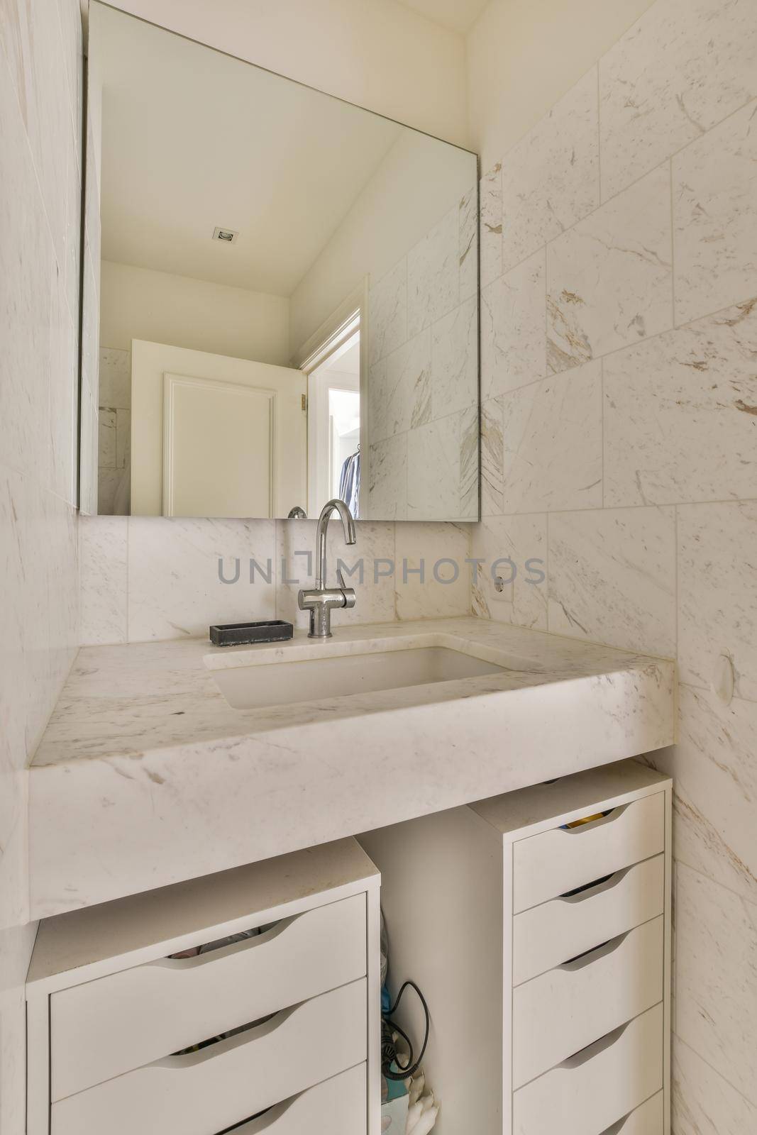 Interior of contemporary bathroom with shower and sink in minimal style in flat