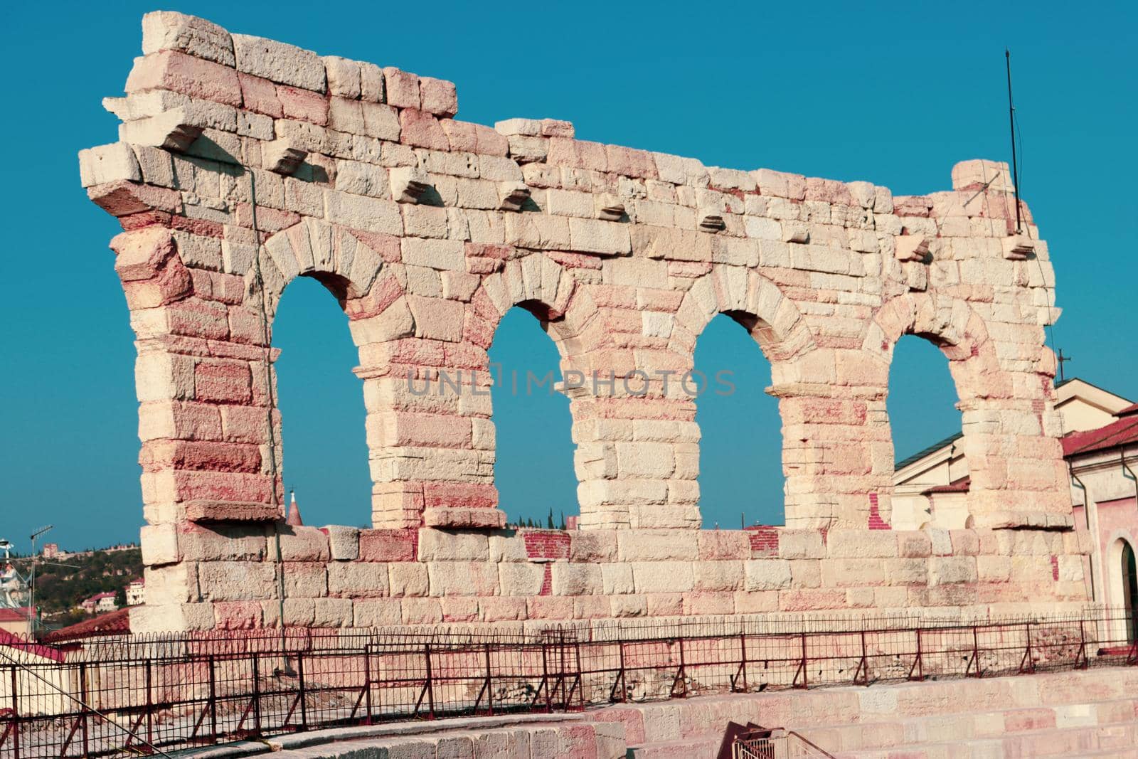 Verona, Italy - March 19, 2022: Beautiful photography of the Arena at Piazza Brà in Verona, a famous Roman amphitheater. Macro view of the old construction by day.