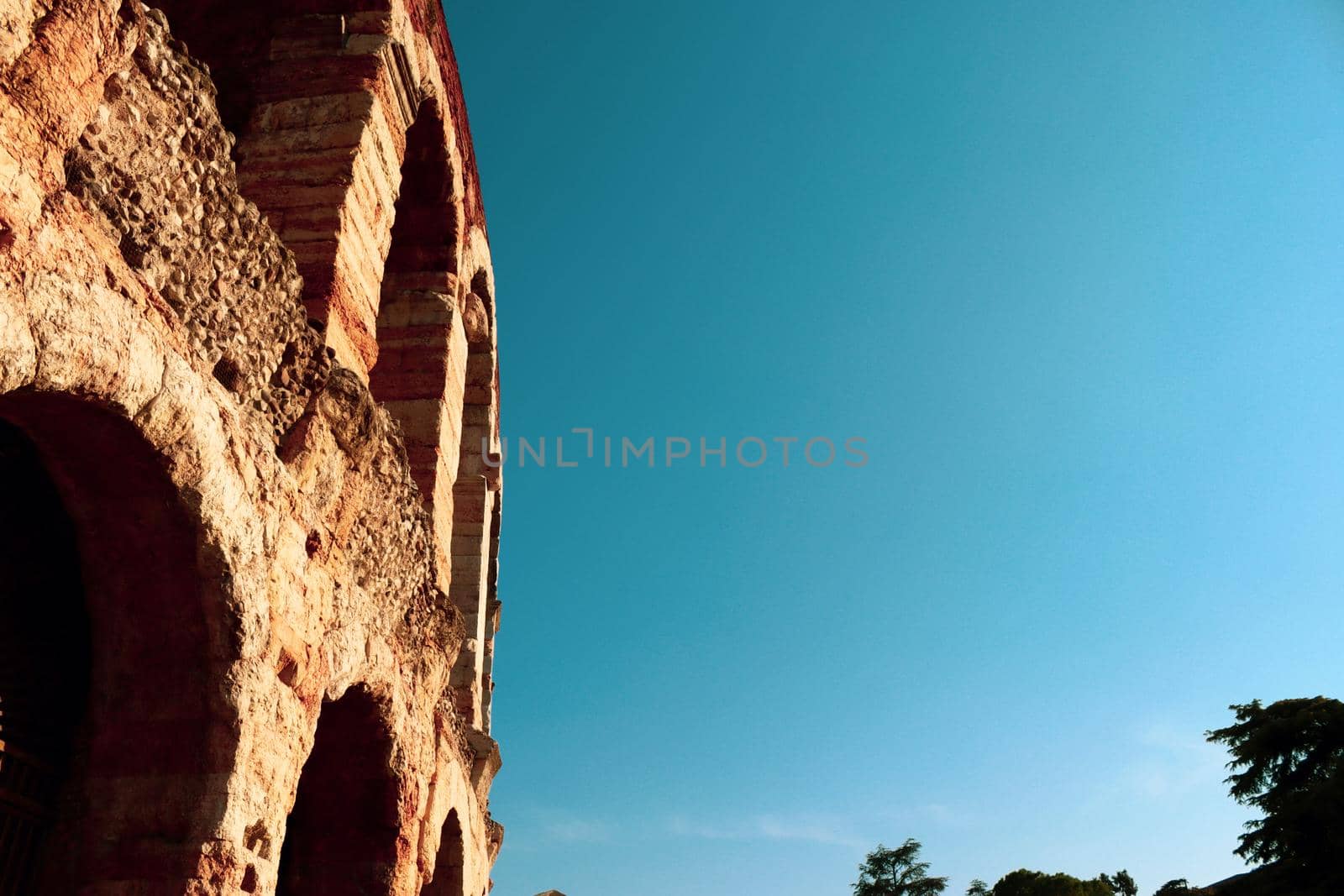 Verona, Italy - March 19, 2022: Beautiful photography of the Arena at Piazza Brà in Verona, a famous Roman amphitheater. Macro view of the old construction by day.