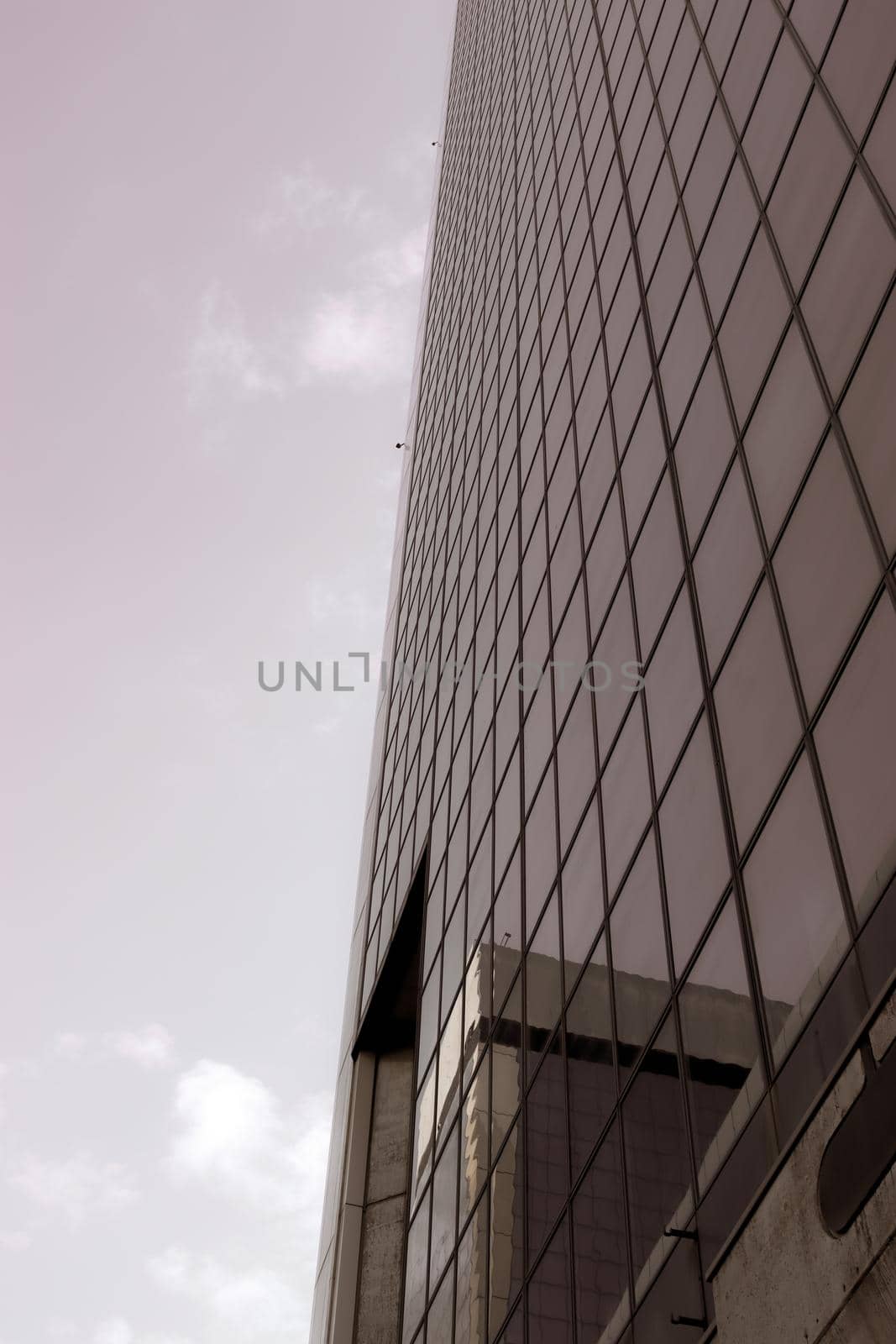 Genova, Italy-January 29, 2022: Beautiful modern high-rise buildings against the sky. 3d illustration on the theme of business success and technology. clouds reflection on the mirror.Industrial zone.