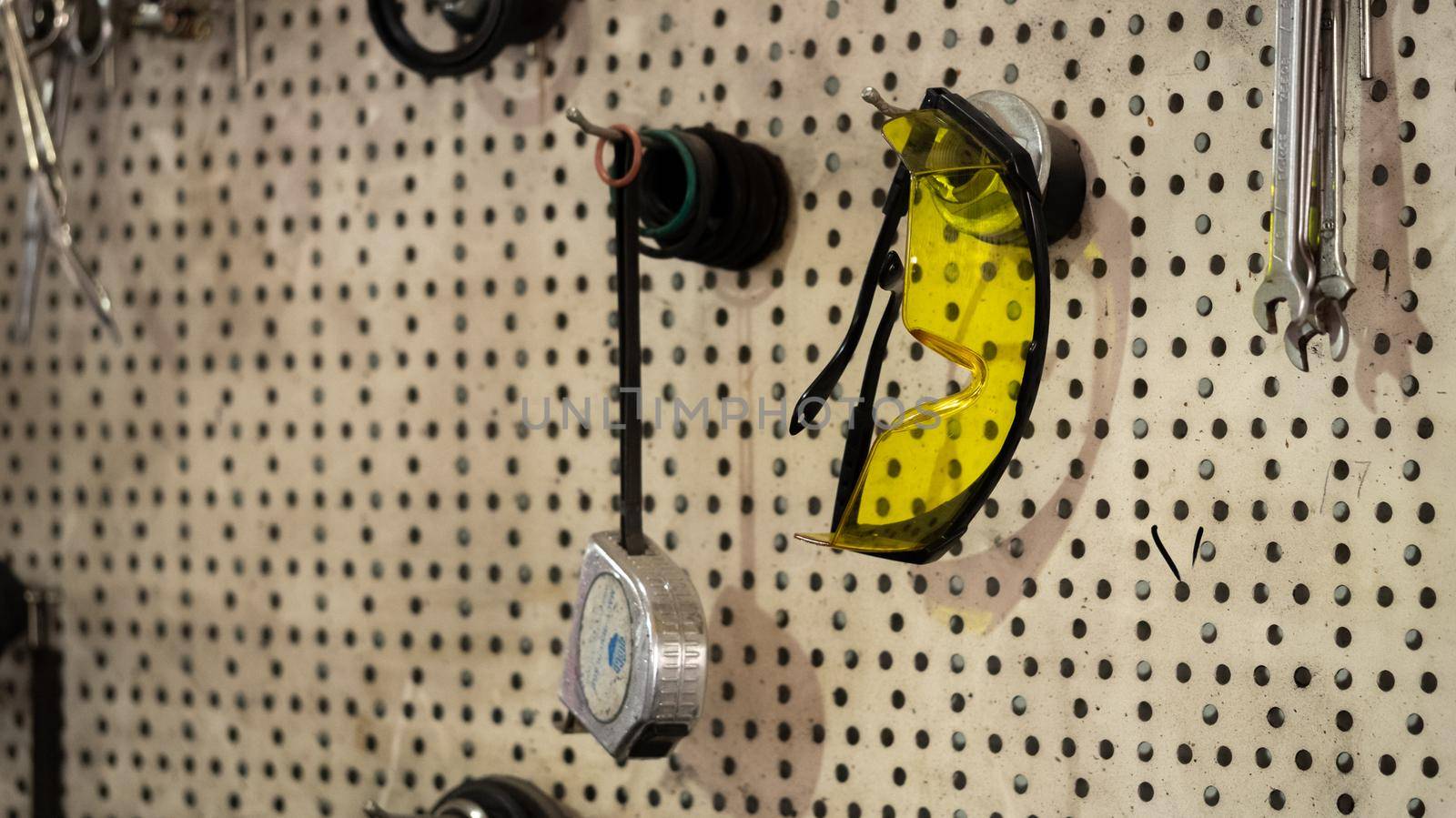 Garage tools hanging on the wall by RecCameraStock