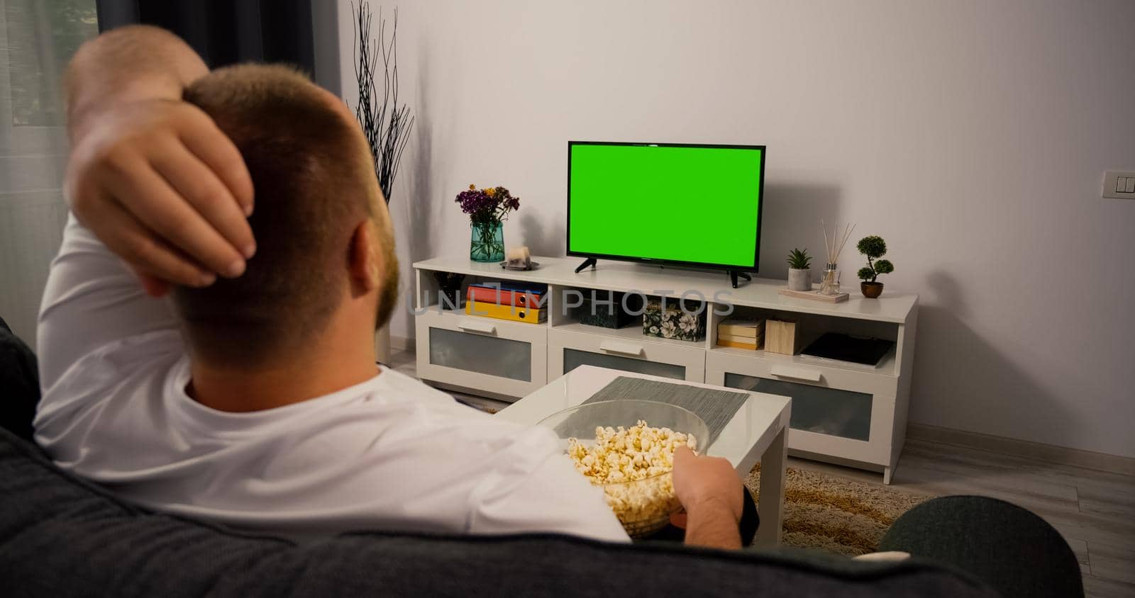 Watching Green Screen Chroma Key TV at home interior. Man Watches a Sport Match. Support favorite Football Rugby Team.