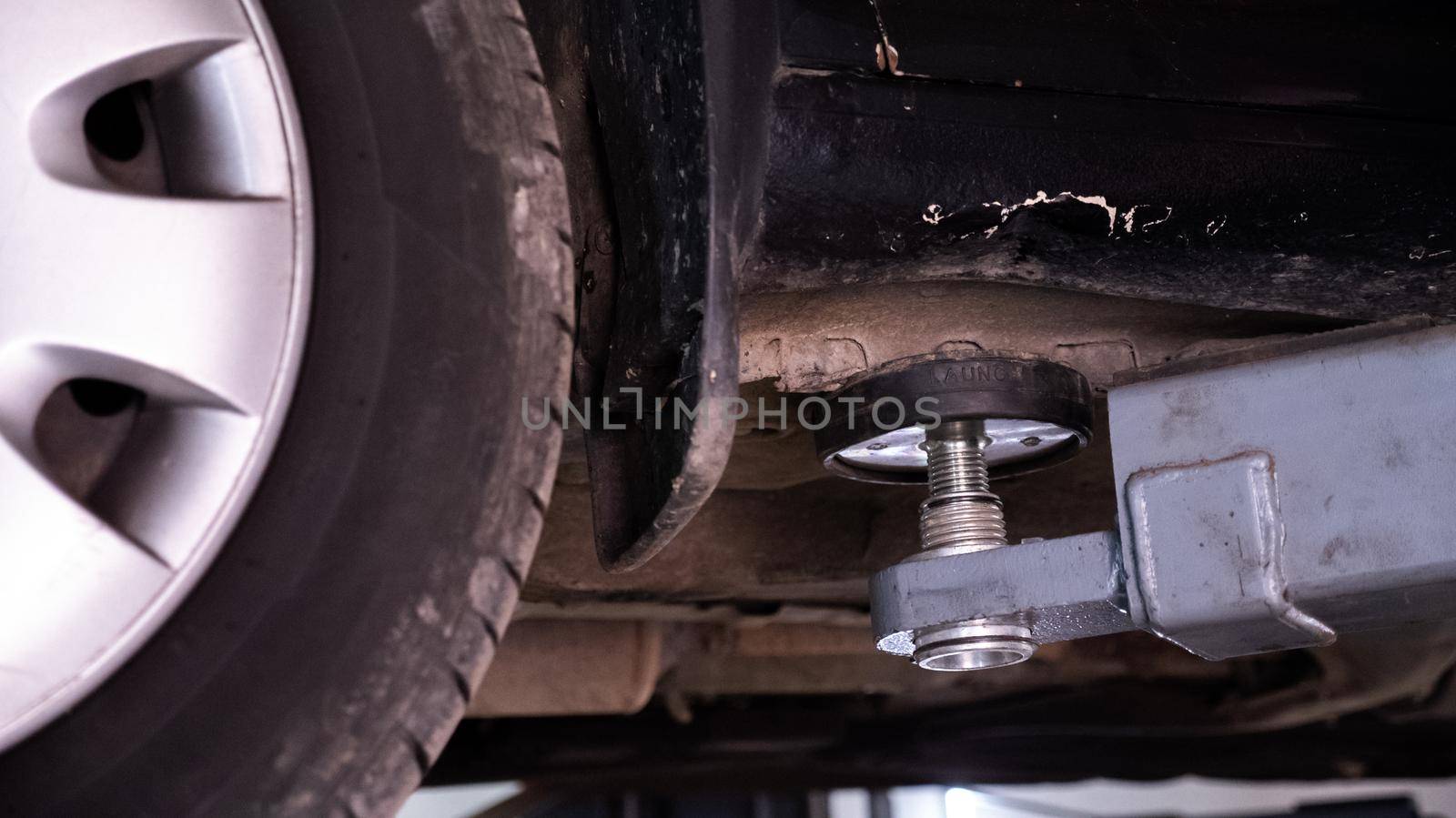 Old car lifting during repairing by RecCameraStock