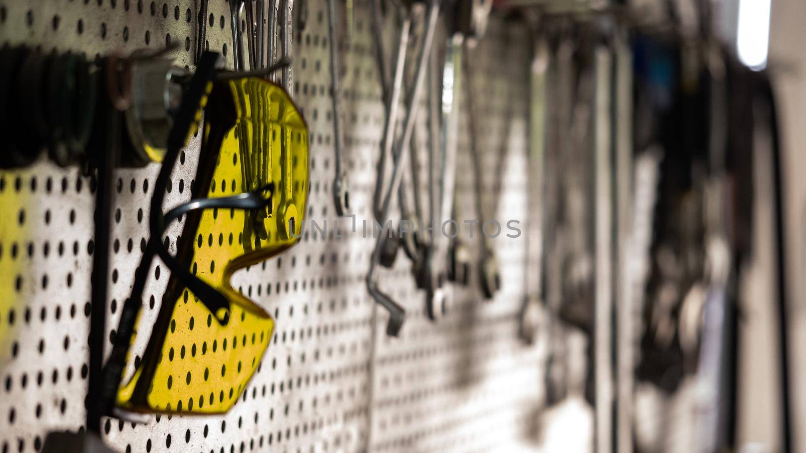 Car repair tools on the wall, mechanical workshop tools by RecCameraStock