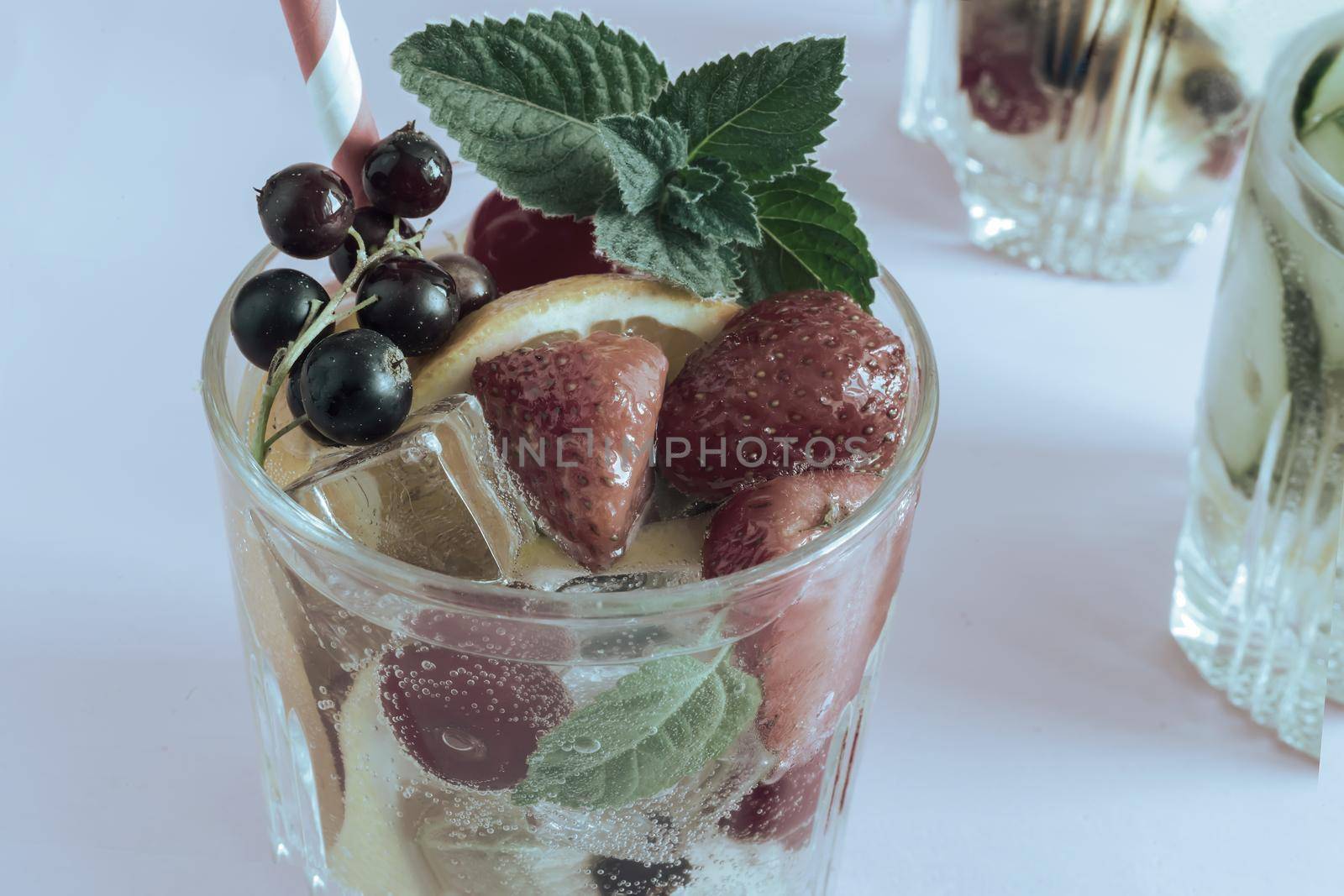 Homemade summer refreshing cocktail of fruits and berries. by georgina198