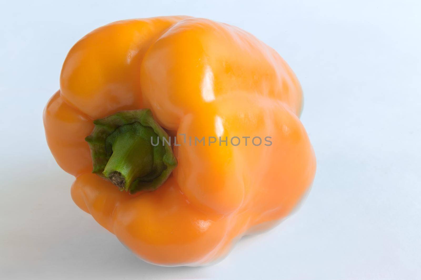 Close-up-the fruit of yellow bell pepper. Presented on a light background.