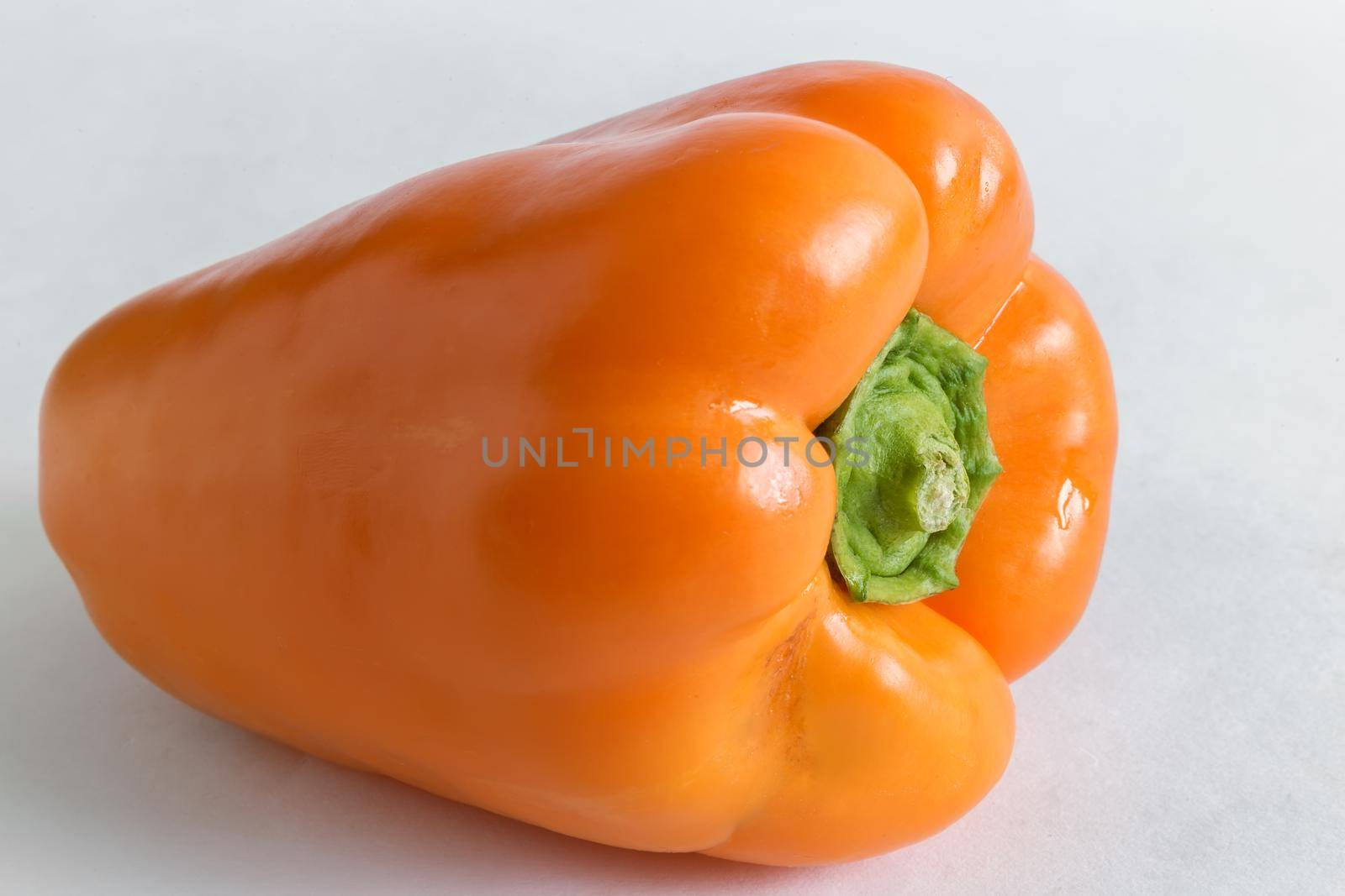 Large yellow bell pepper on light background by georgina198