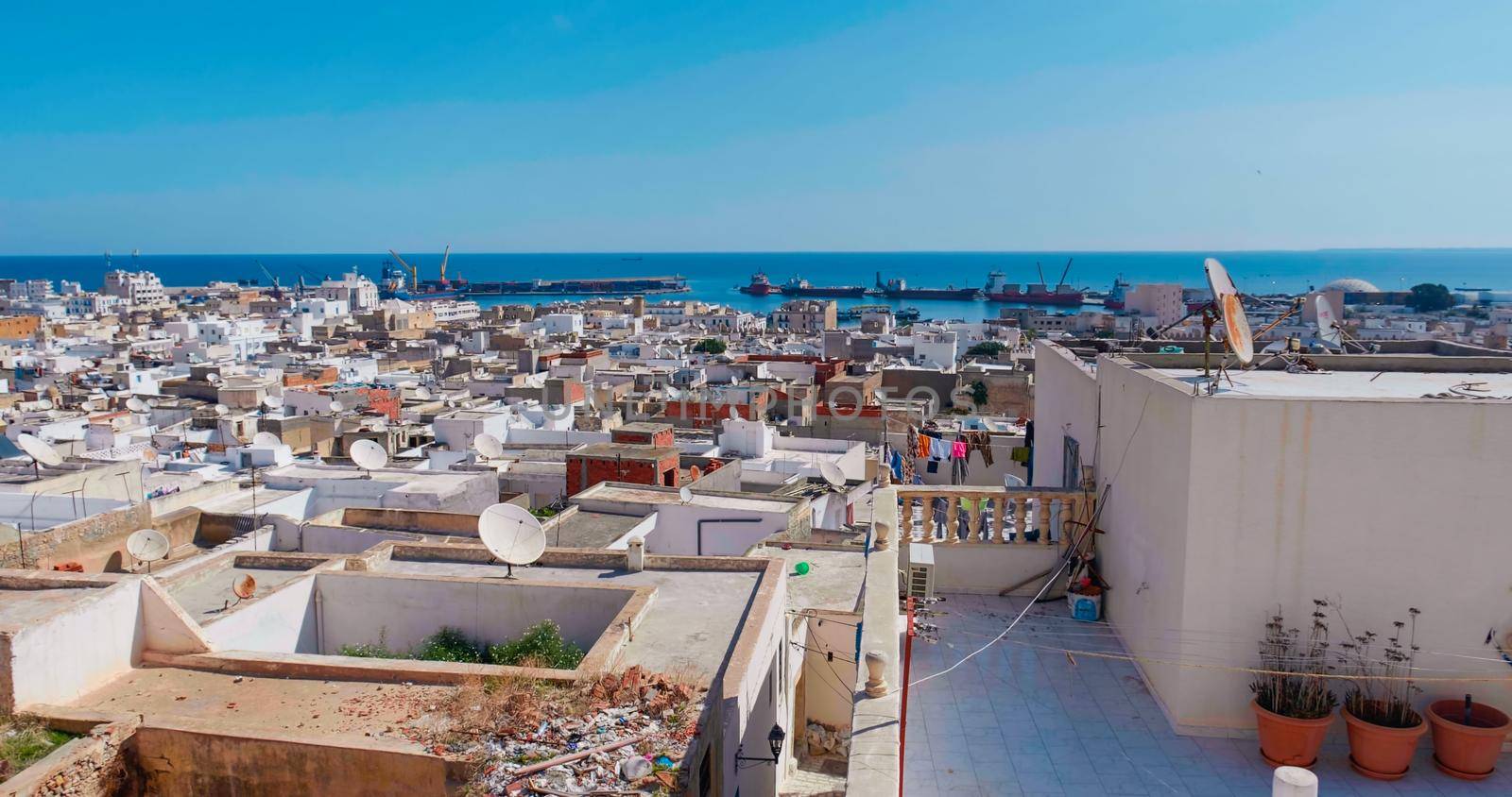 Sousse Port, Tunisia. View of port from city building. Port area with buildings, houses, cargo warehouses.