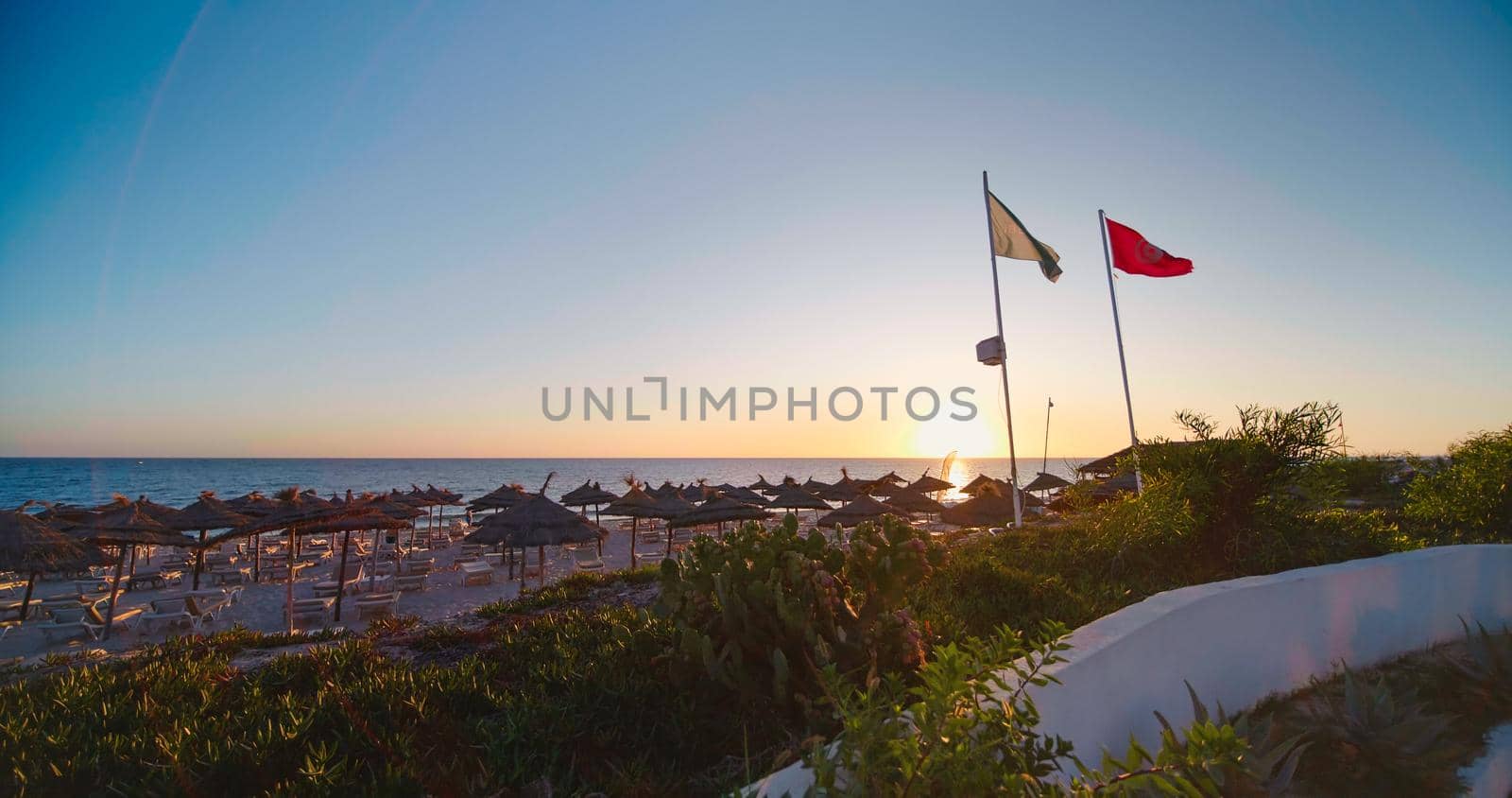 Sun loungers and umbrellas on the beach, by RecCameraStock