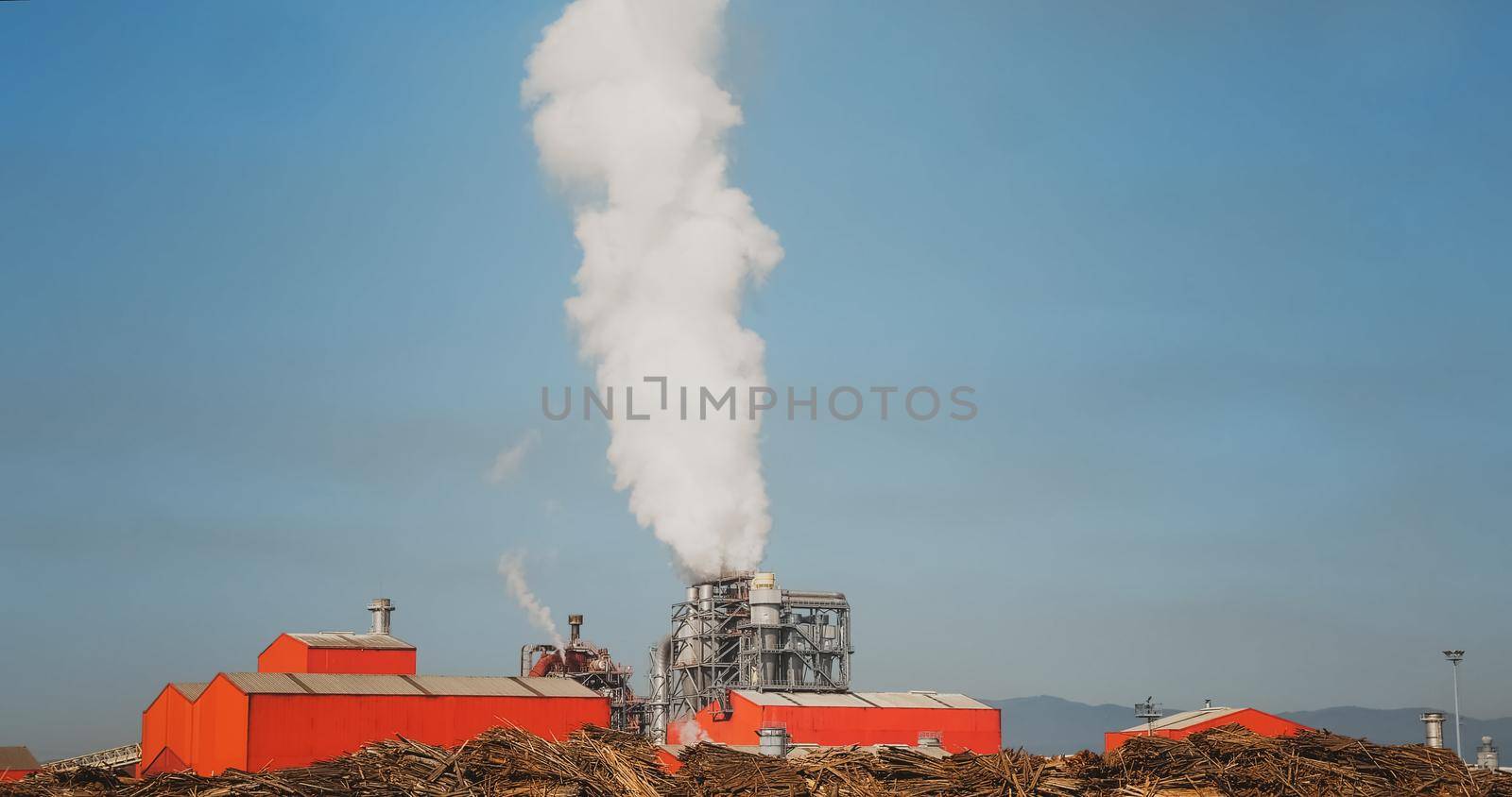 Factory pumping out smoke and steam. by RecCameraStock