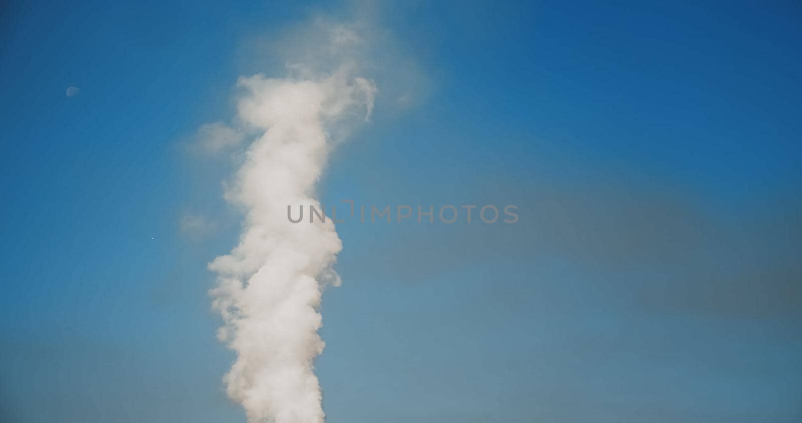 SMOKE Pollute Industry Atmosphere With Smoke Ecology pollution, Industrial Factory Pollutes. Global Warming. Smoke details on blue sky background.