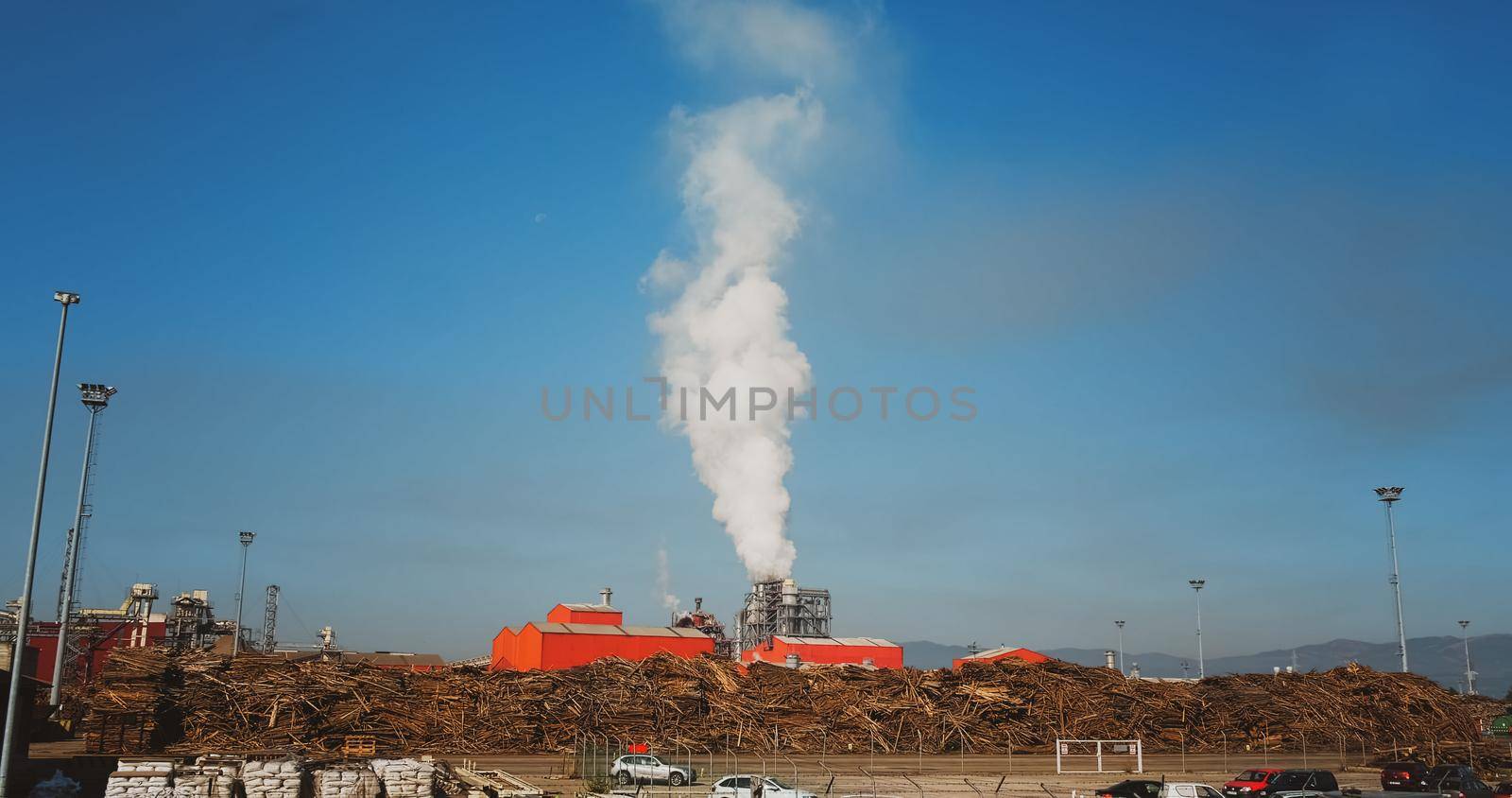 Factory pumping out smoke in the morning by RecCameraStock