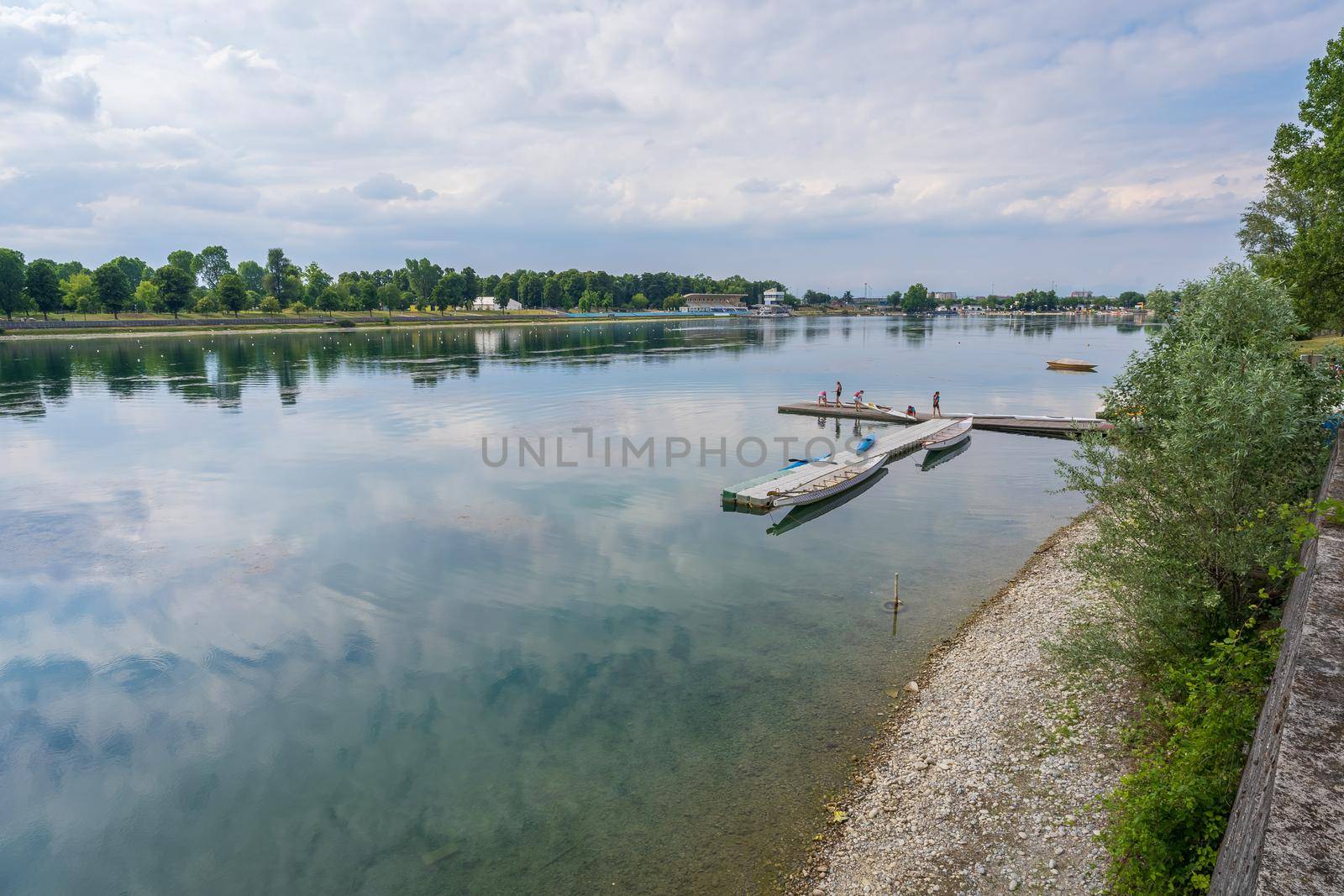 boys and girls prepare their canoes to training by Robertobinetti70