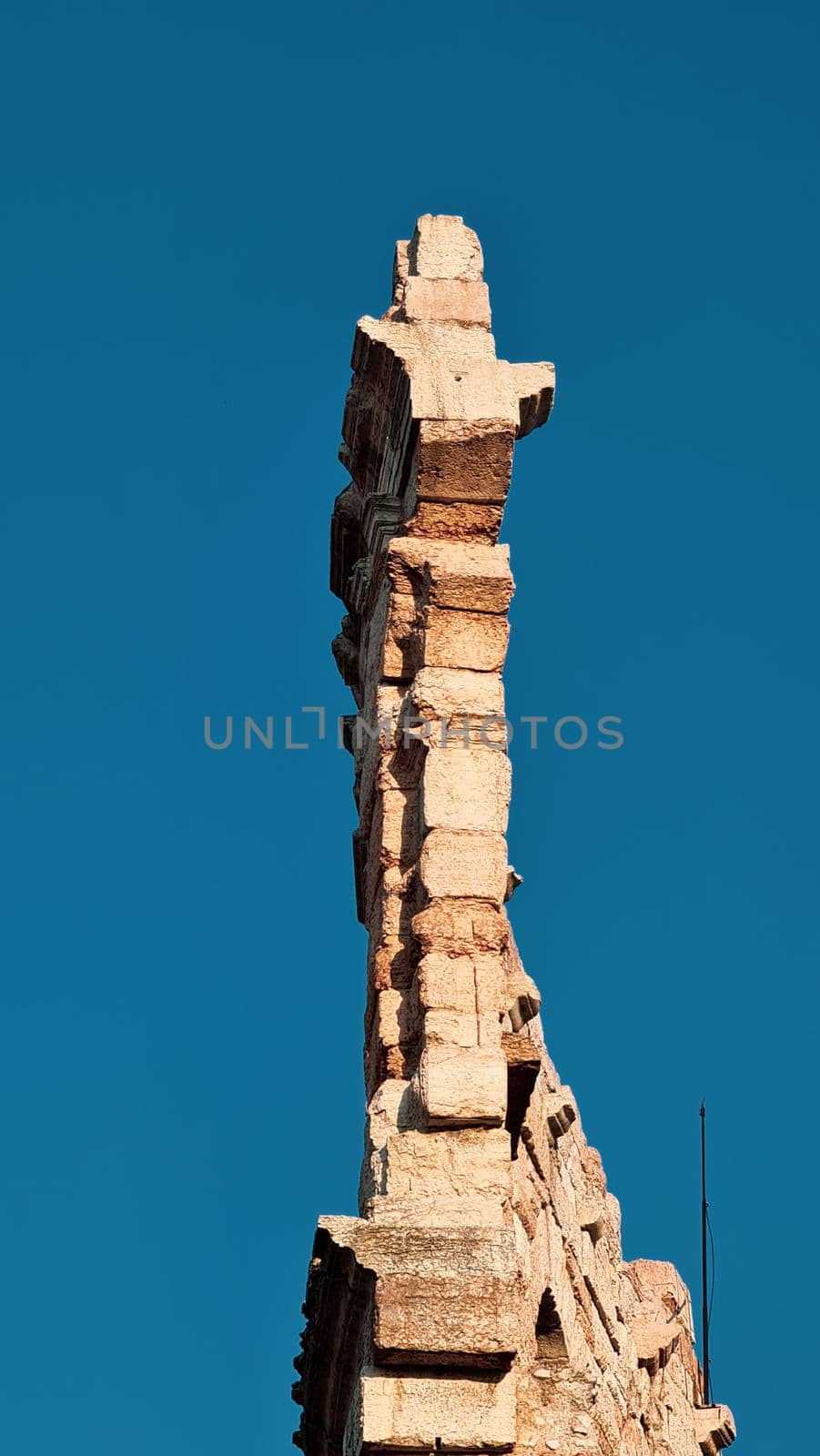 Verona, Italy - March 19, 2022: Beautiful photography of the Arena at Piazza Brà in Verona, a famous Roman amphitheater. Macro view of the old construction by day.