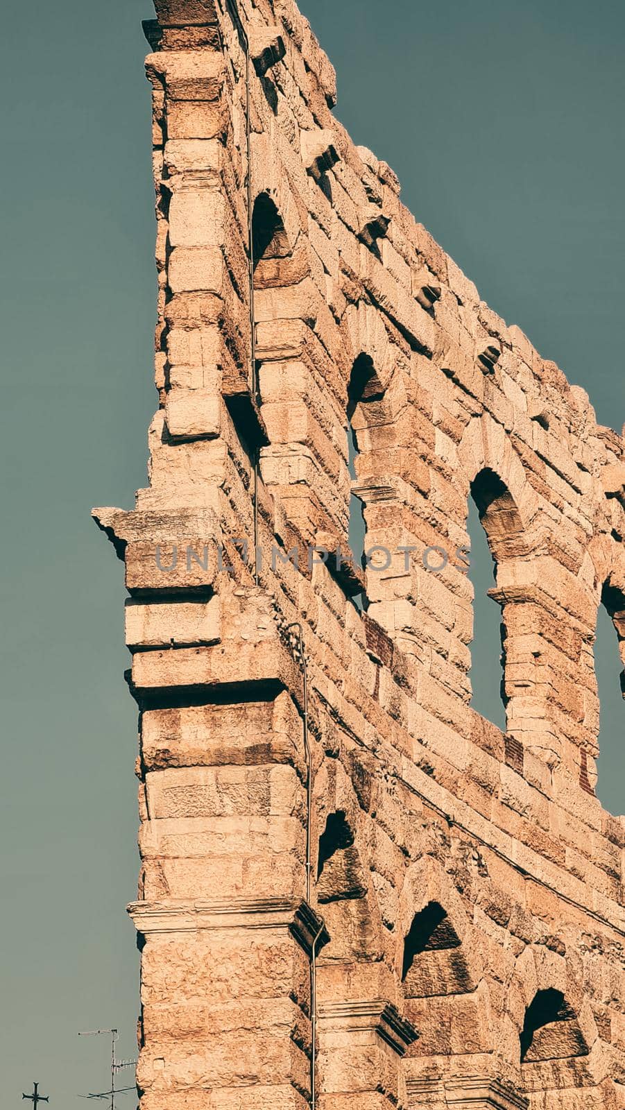 Verona, Italy - March 19, 2022: Beautiful photography of the Arena at Piazza Brà in Verona, a famous Roman amphitheater. Macro view of the old construction by day.