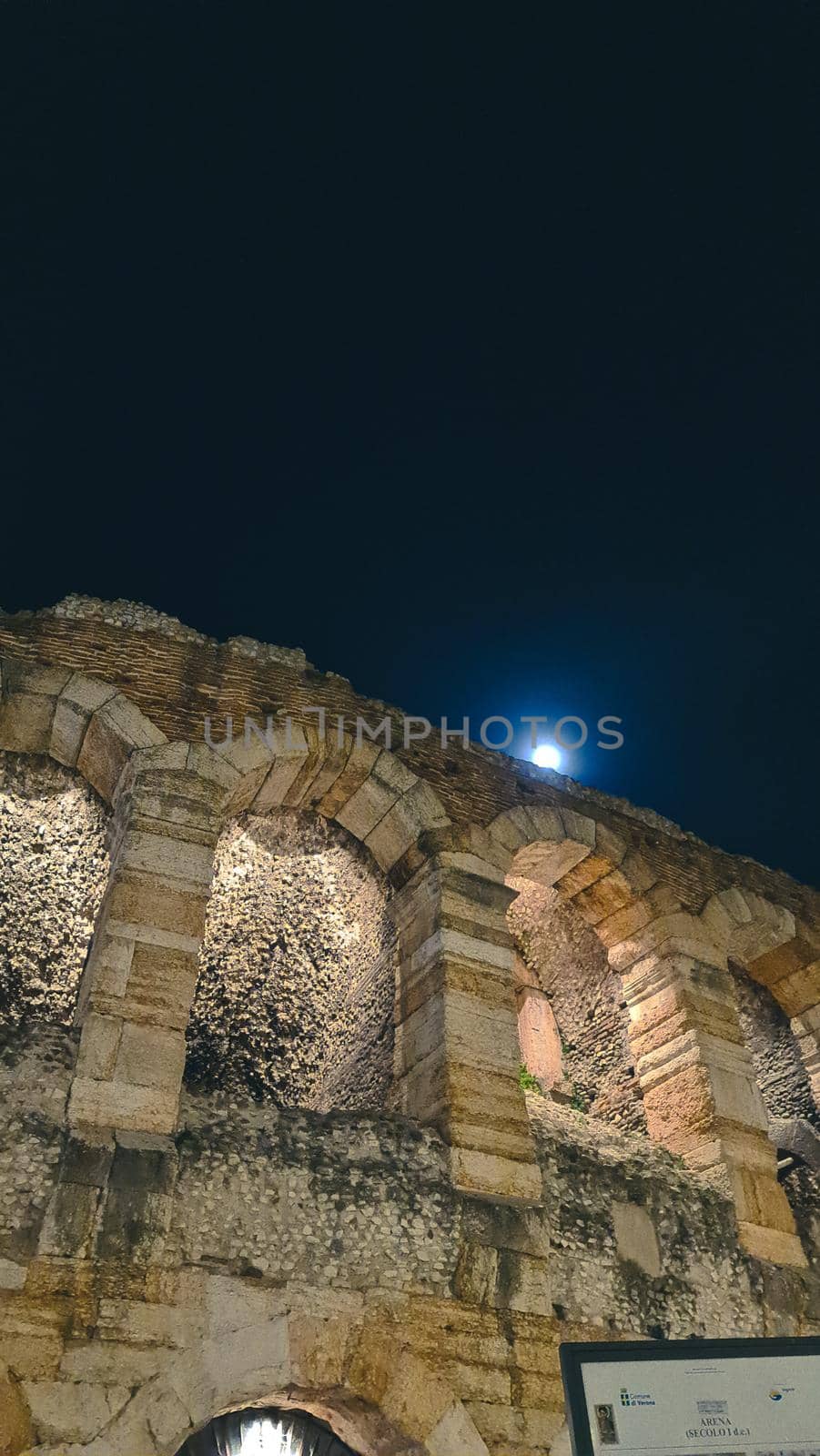 Verona, Italy - March 19, 2022: Beautiful photography of the Arena at Piazza Brà in Verona, a famous Roman amphitheater. Macro view of the old construction by day.