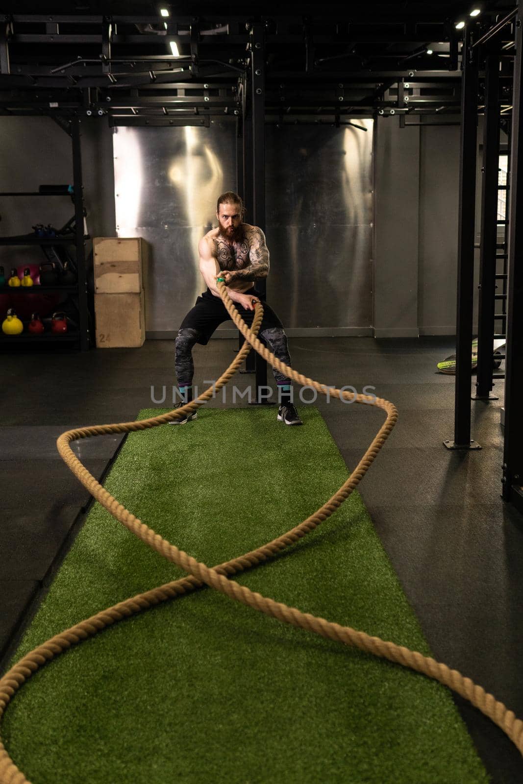 Rope man grass warehouse green fitness training gym exercising exercise, for athlete one from male from healthy moving, sport muscle. Standing ground holding, lifestyles