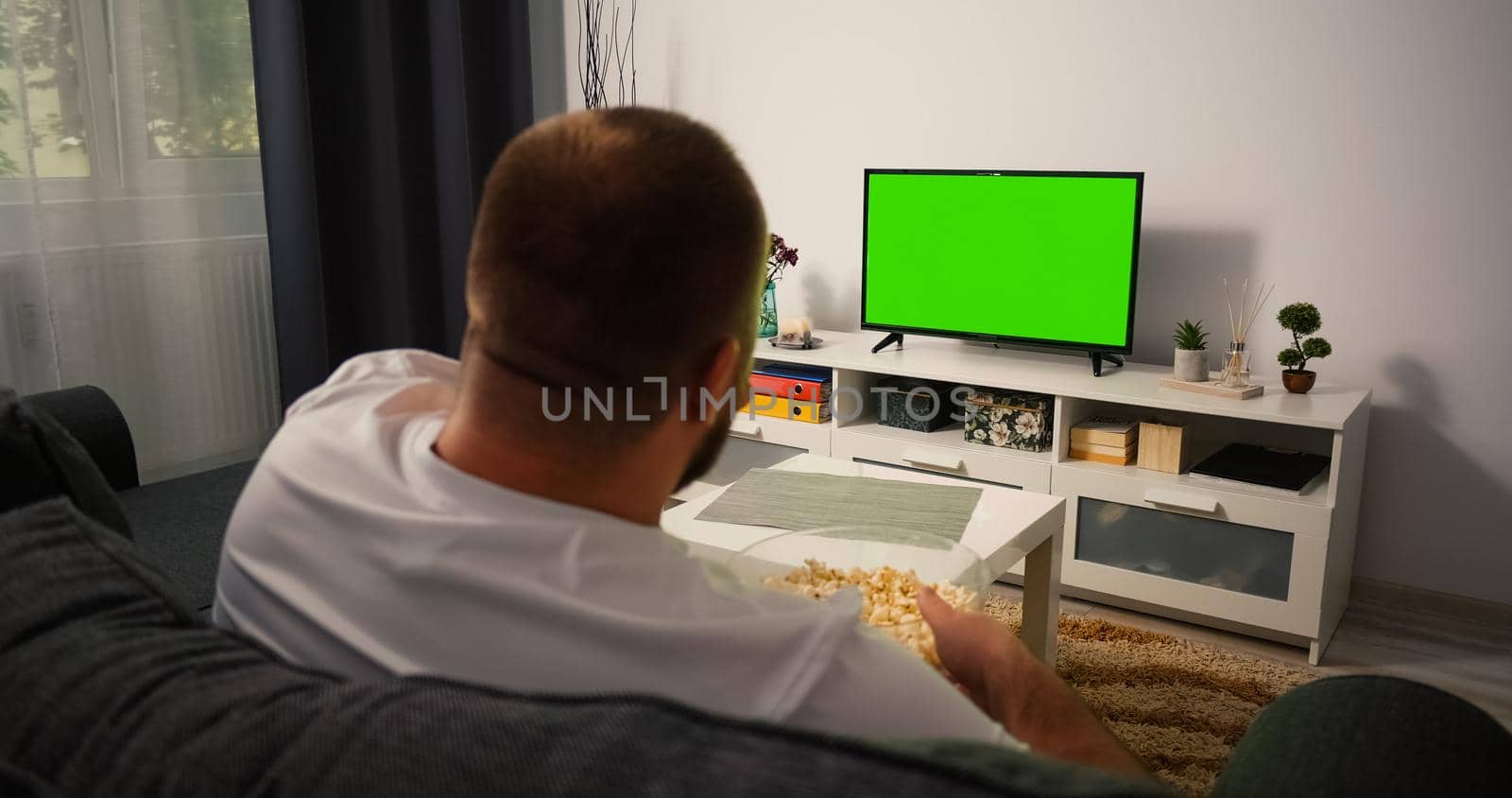 Man Watching Television with Green Screen Chroma Key, by RecCameraStock