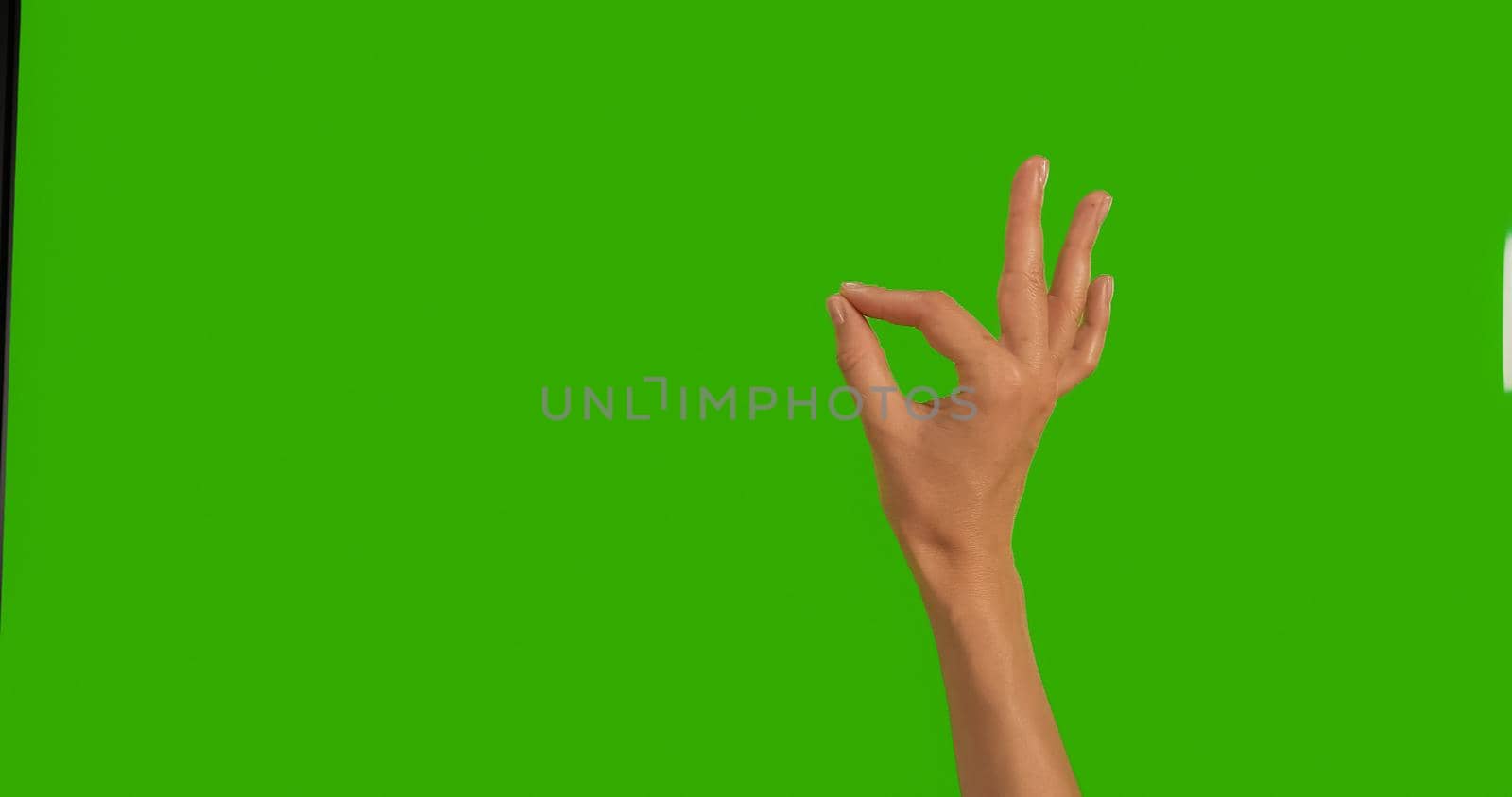 Gestures female Hand OKAY OK Everything is Good on a Green Background, Green Screen, Chroma Key Close-up. Make symbols with hand on Greenscreen.