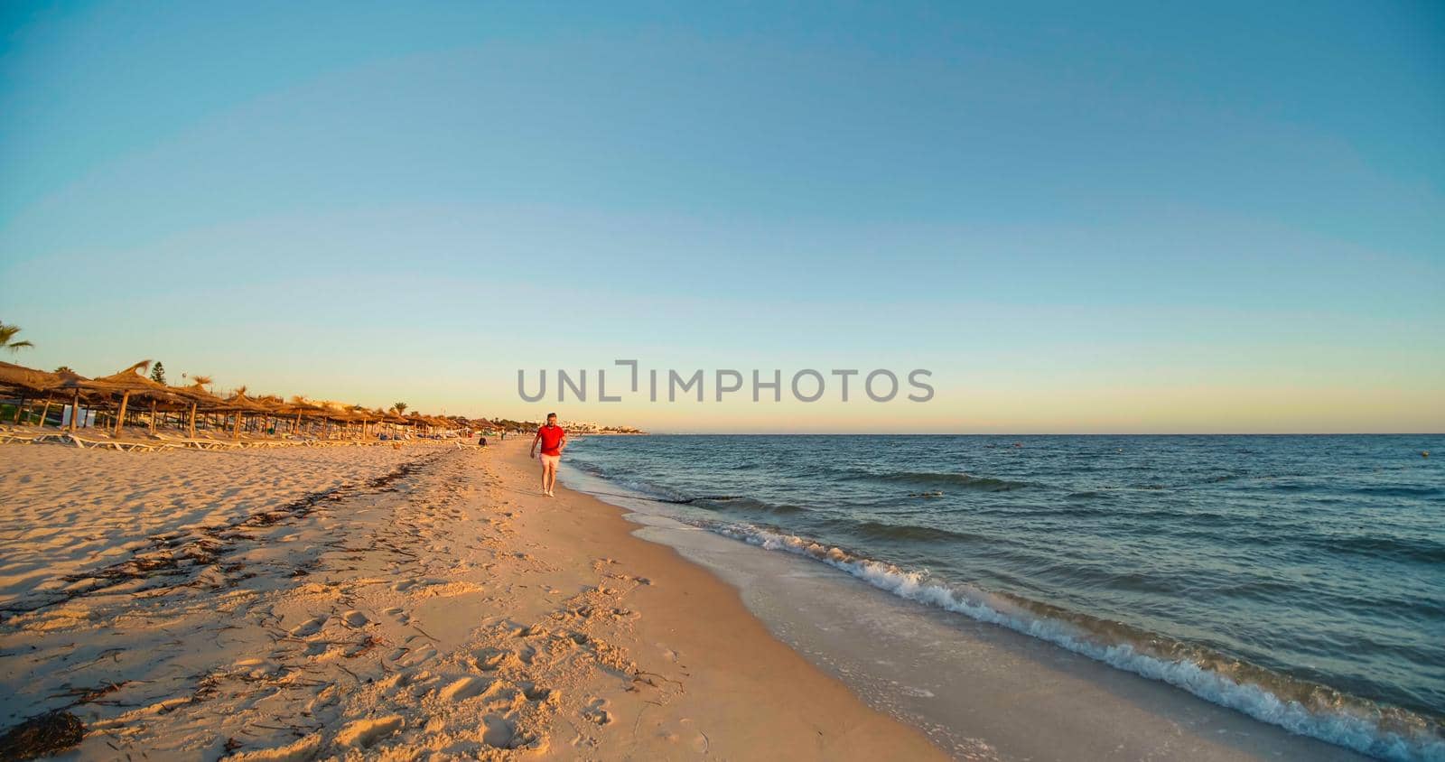 People enjoying life, exotic holiday vacation, holiday destination at the sea. Beach resort in Tunisia, Africa.