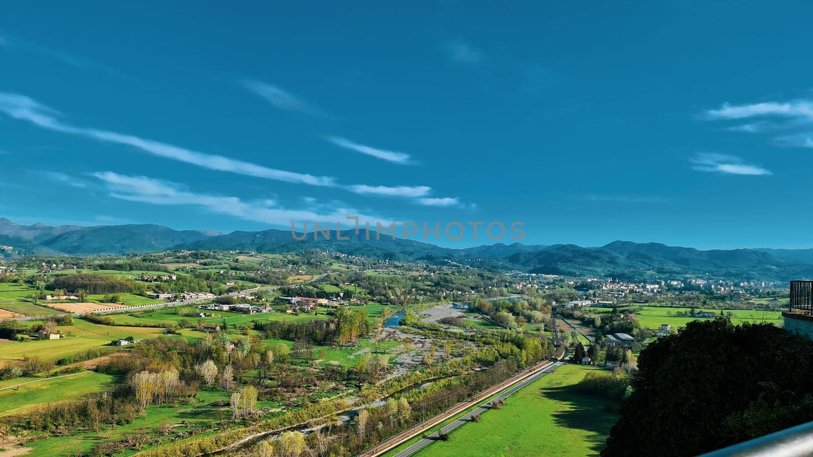 Genova, Italy - January 28, 2022: Park of Nervi by winter days. Green park for relax. Natural park near the sea, with some tall trees. Clear blue sky in the background.