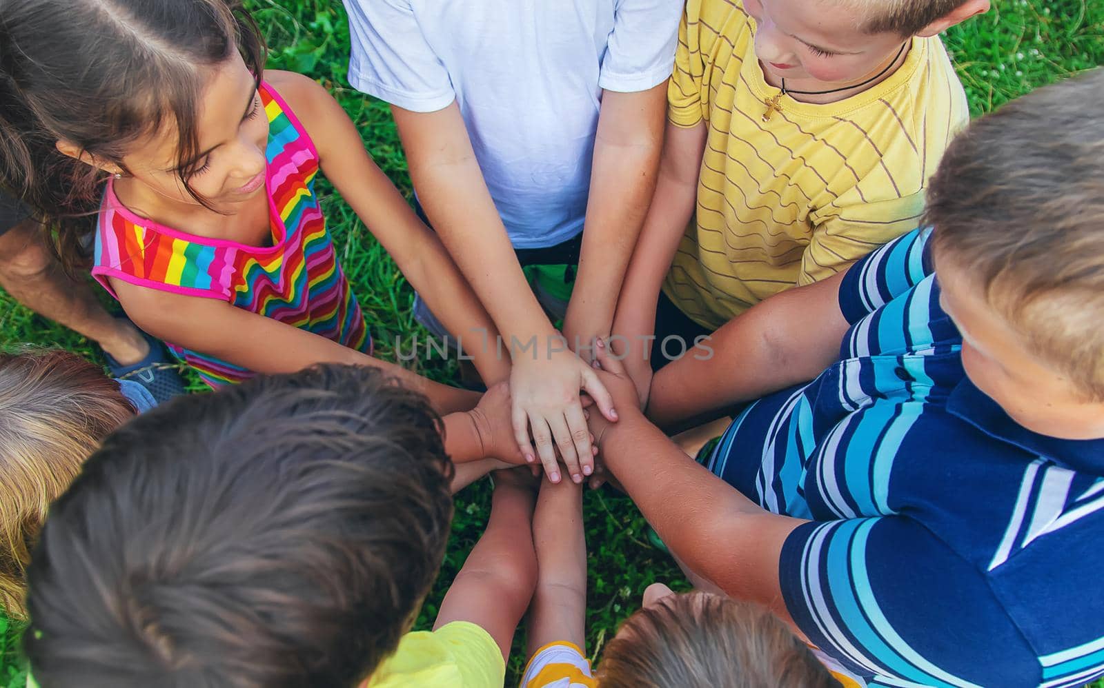 Children's friendship, children's hands on the street. Selective focus. Kid.