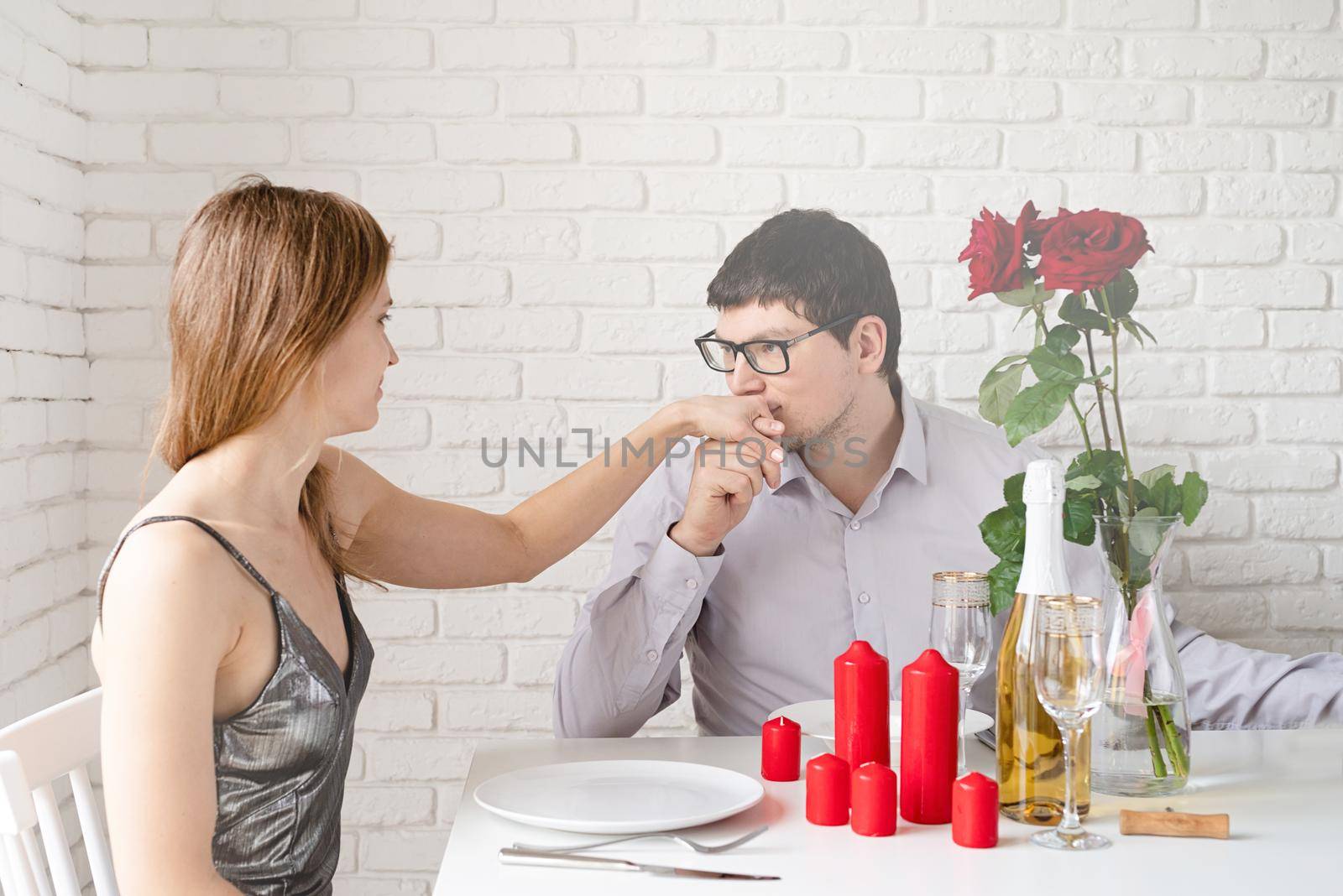 romantic date. Couple in love having romantic date at home by Desperada