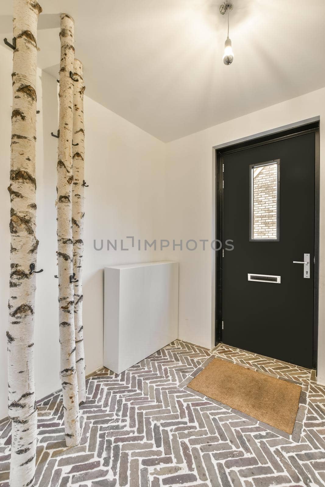 Corridor with designer hangers and tiled floor in minimalism style