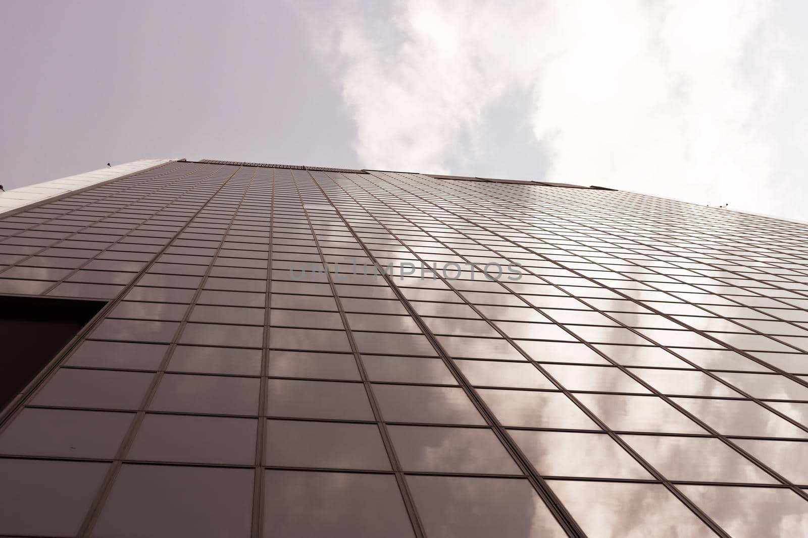 Genova, Italy-January 29, 2022: Beautiful modern high-rise buildings against the sky. 3d illustration on the theme of business success and technology. clouds reflection on the mirror.Industrial zone.