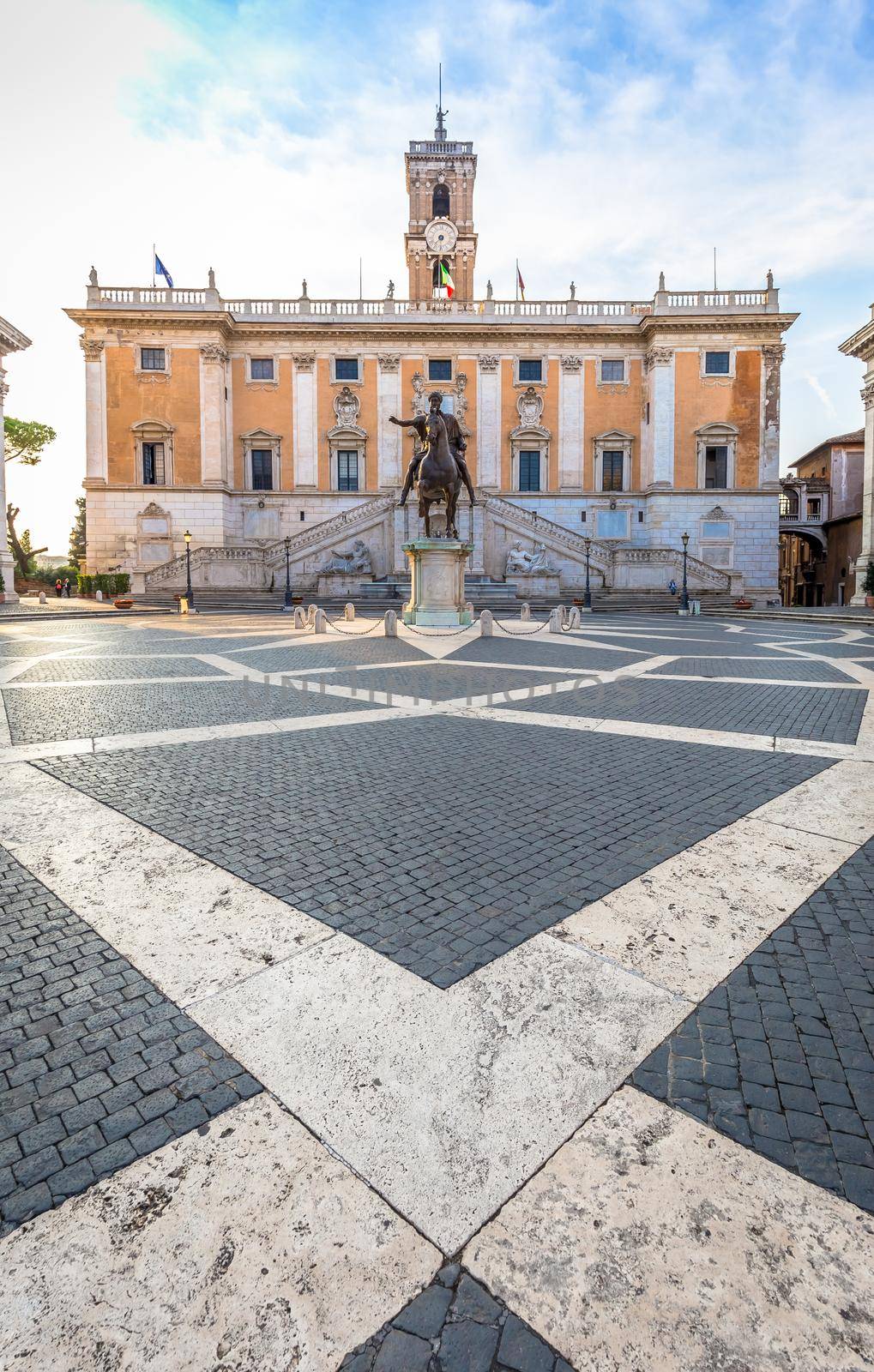ROME, ITALY - CIRCA AUGUST 2020: Capitolium Square (Piazza del Campidoglio). Made by Michelangelo, it is home of Rome (Roma) City Hall. Sunrise light, before turist arrival.