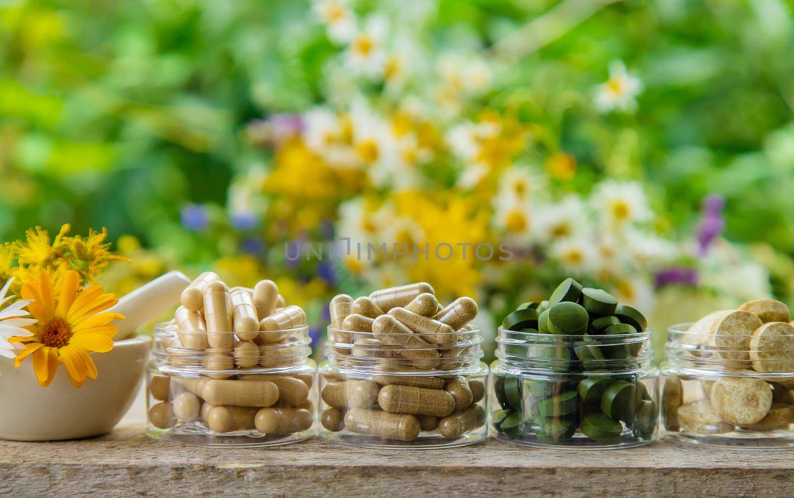 Supplements and vitamins with medicinal herbs. Selective focus. by yanadjana