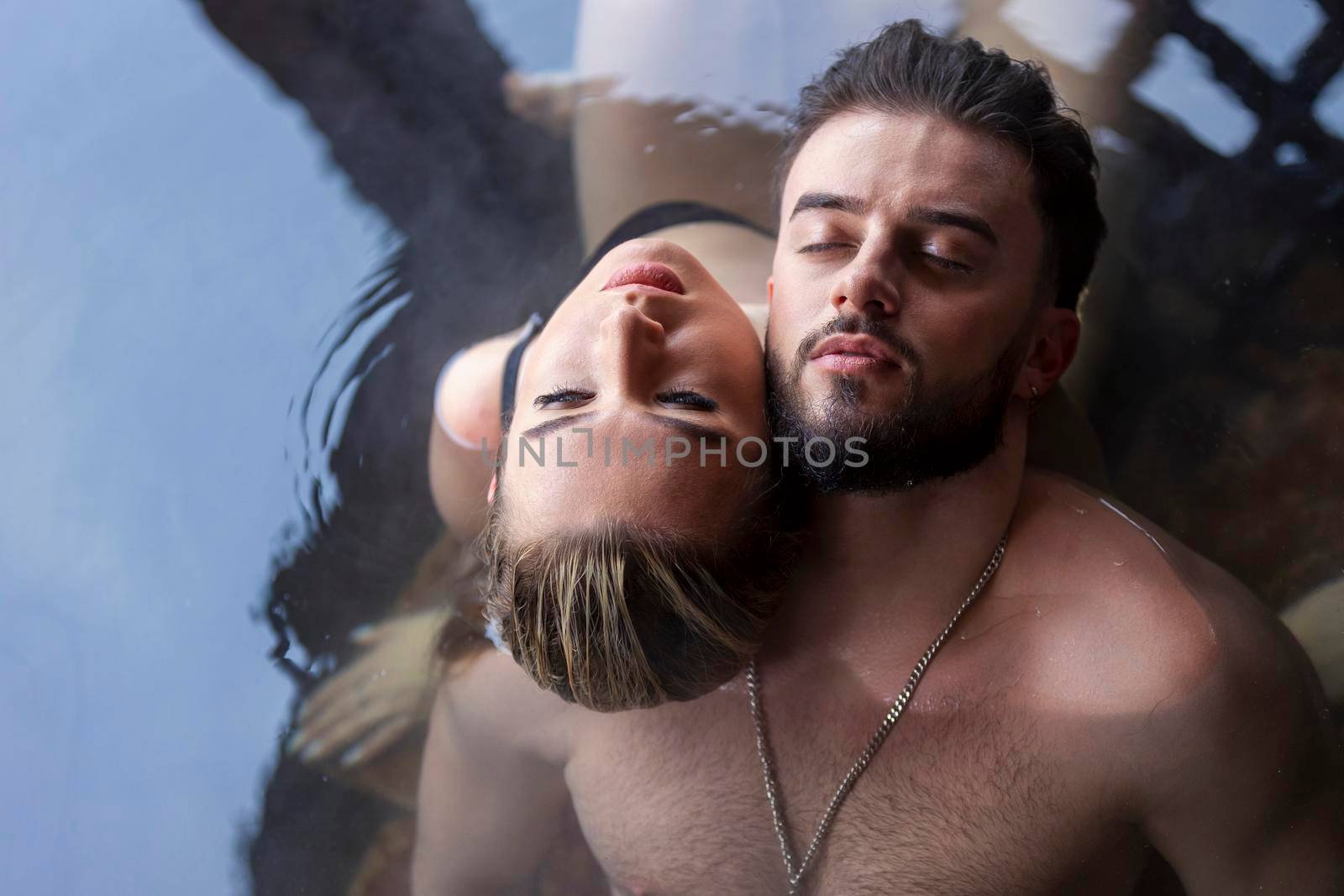 couple sitting in vats top view