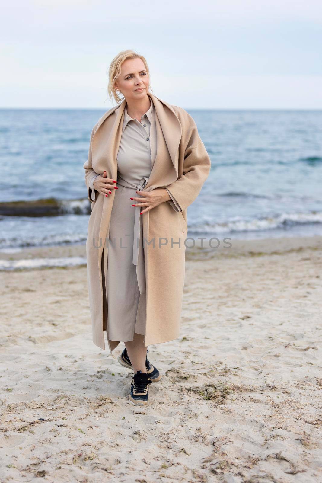 Aged woman on the background of the sea