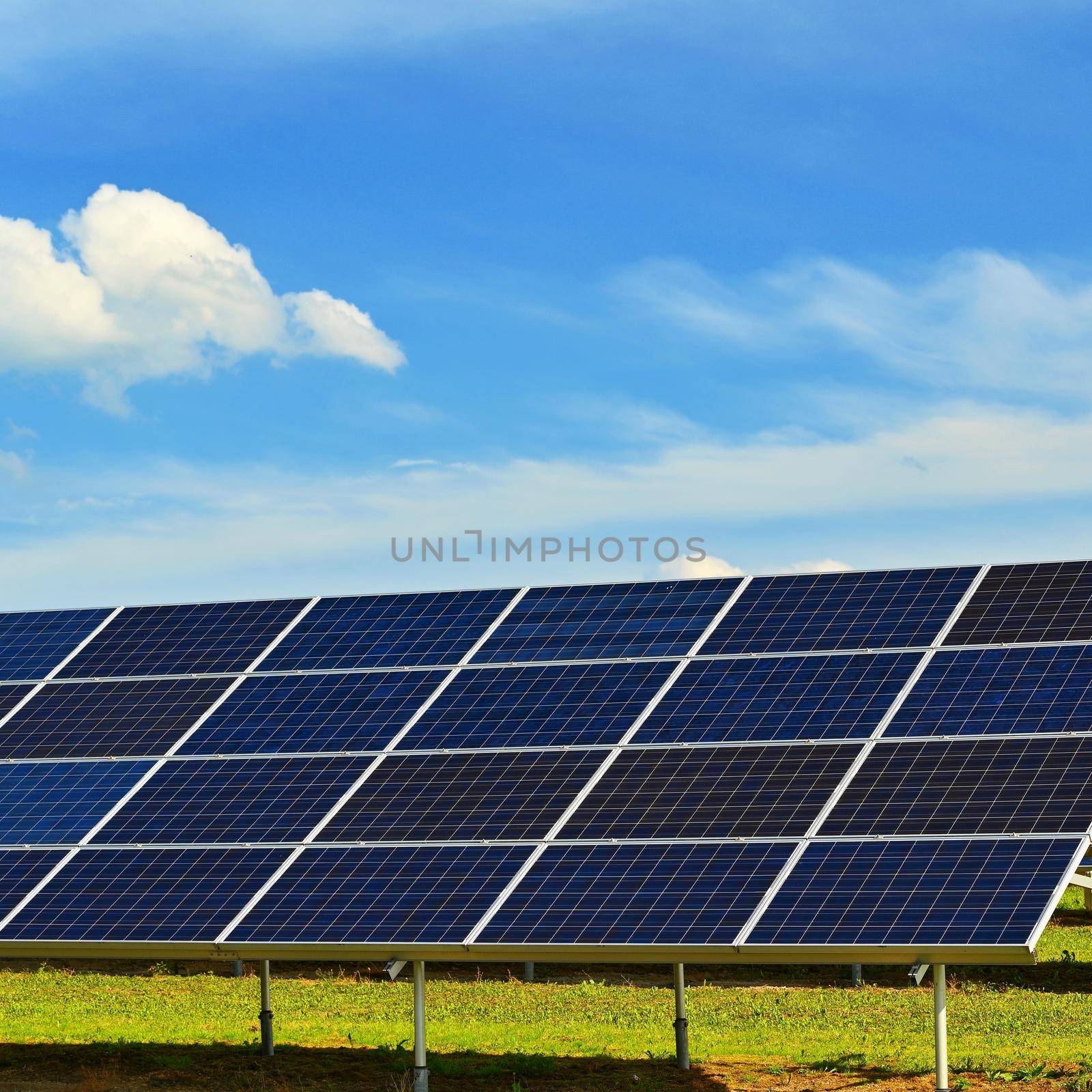 Solar power plant - concept for electricity and ecological industry. High energy prices. Beautiful landscape and sunny day with blue sky.. photovoltaic power plant by Montypeter