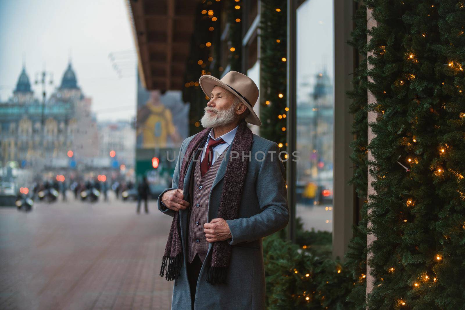 portrait of a bearded man aged on the street in the city