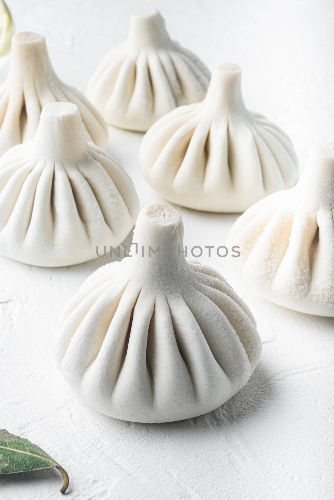 Manti, Turkish traditional ravioli set, on white stone surface