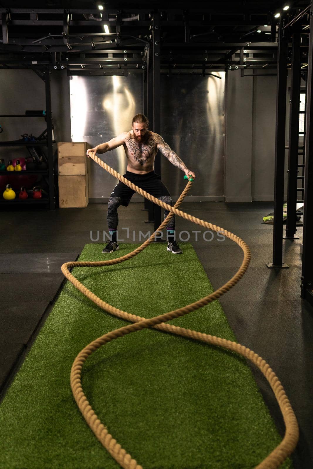 Rope man grass warehouse green fitness training gym exercising exercise, for athlete one from male from healthy moving, sport muscle. Standing ground holding, lifestyles