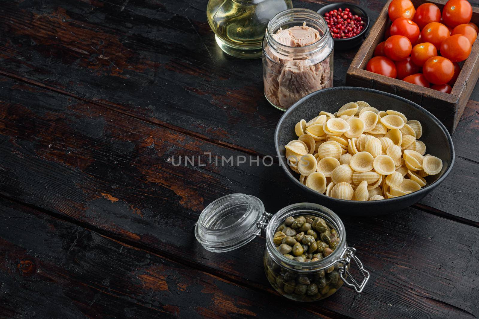 Tuna pasta cooking ingredients, on old wooden table with copy space for text by Ilianesolenyi
