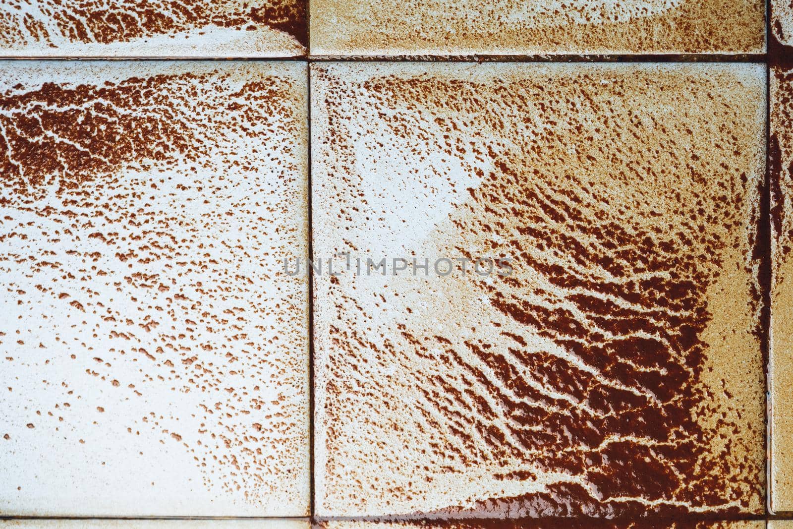 abstract wet rust scattering on a tile background