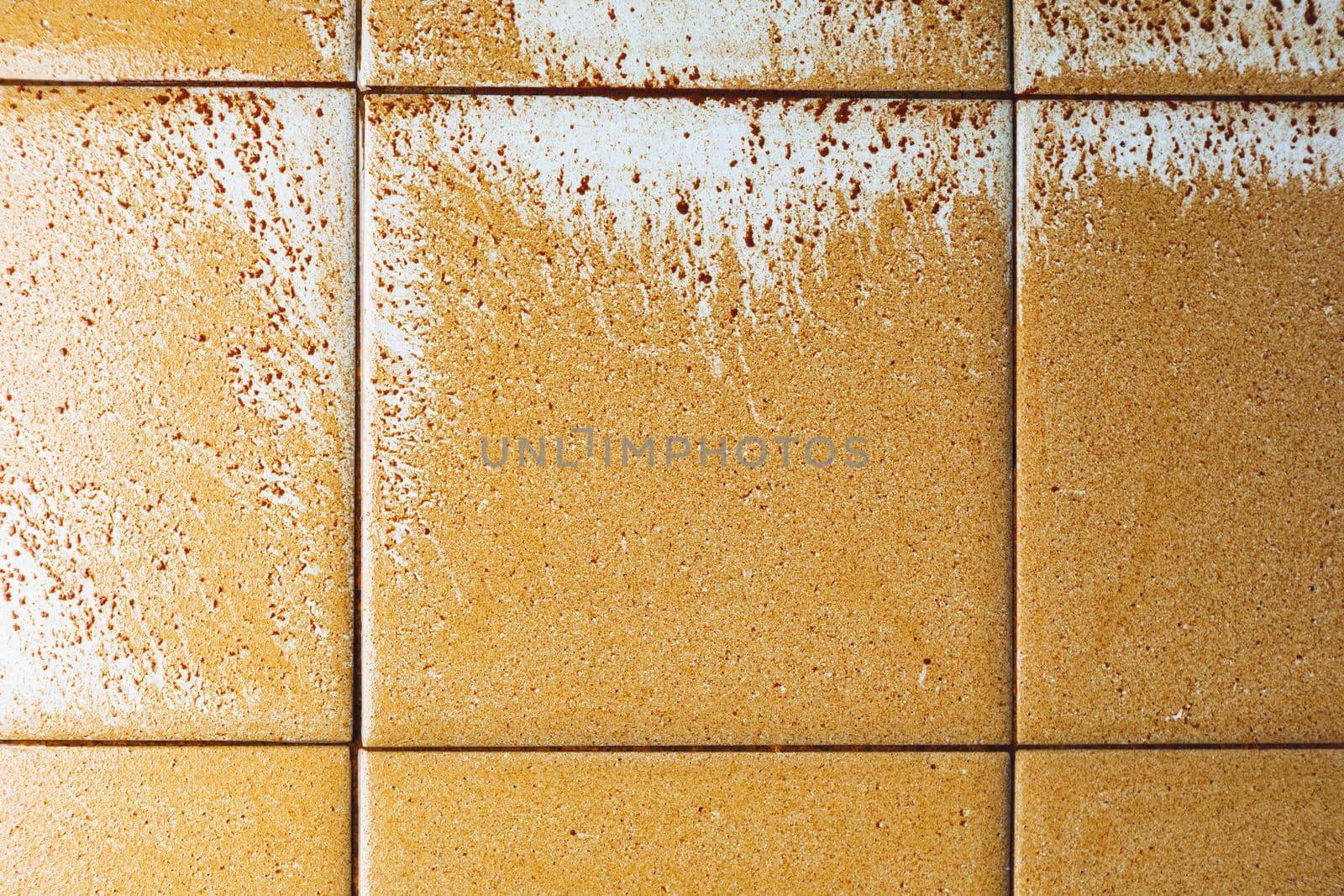 abstract wet rust scattering on a tile background