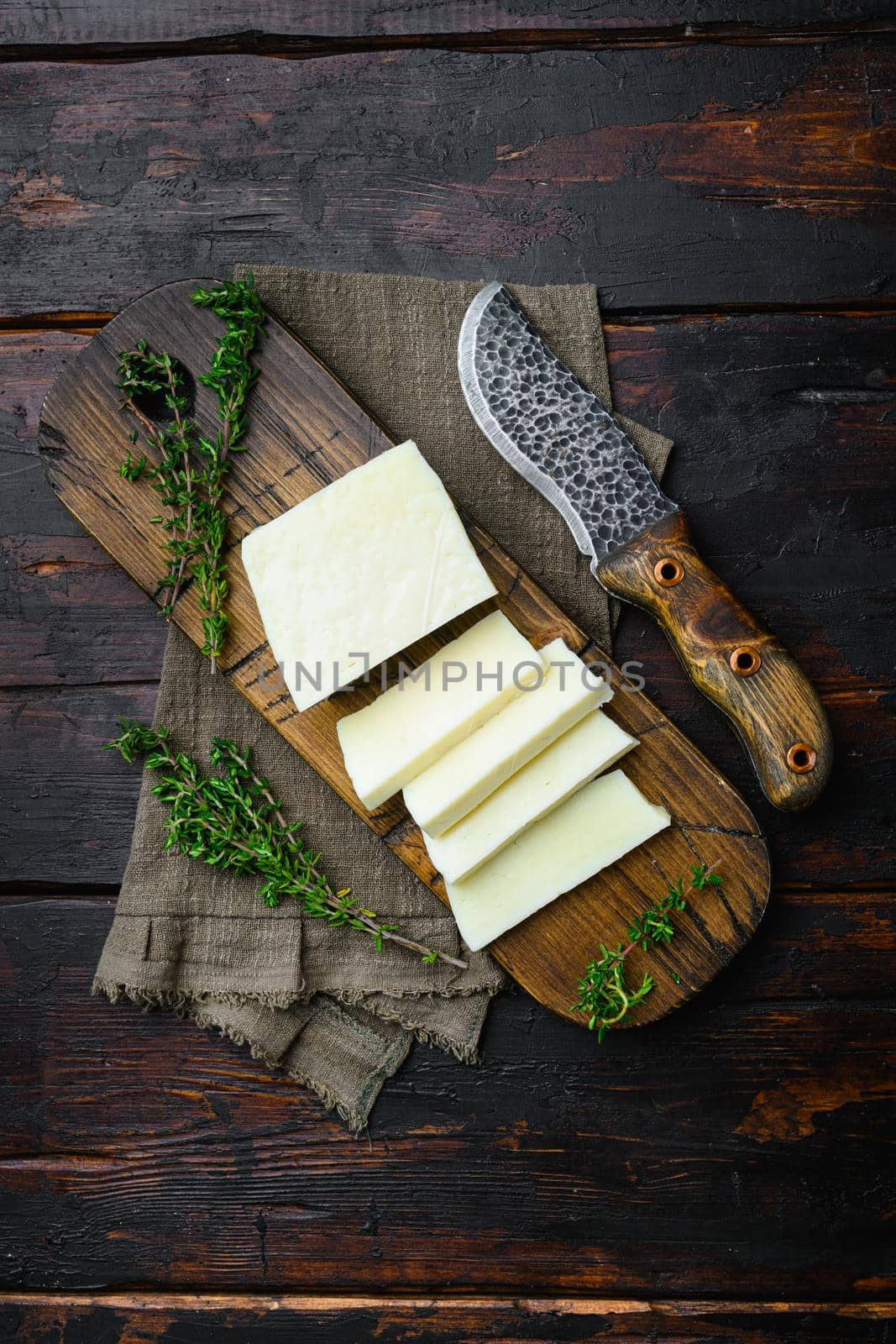 Fresh halloumi cheese set, on old dark wooden table background, top view flat lay by Ilianesolenyi