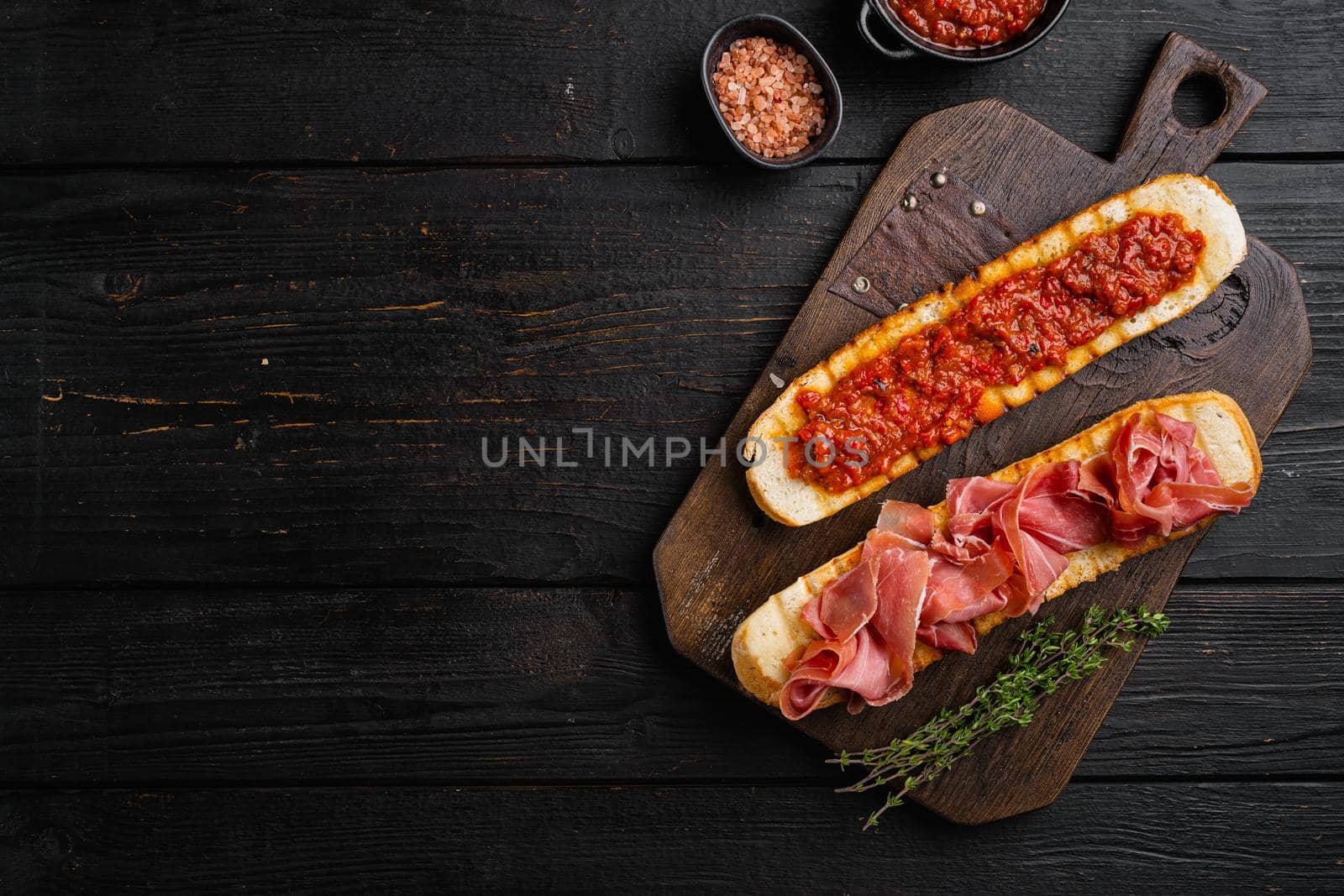 Healthy breakfast with homemade bread toast set, on black wooden table background, top view flat lay, with copy space for text