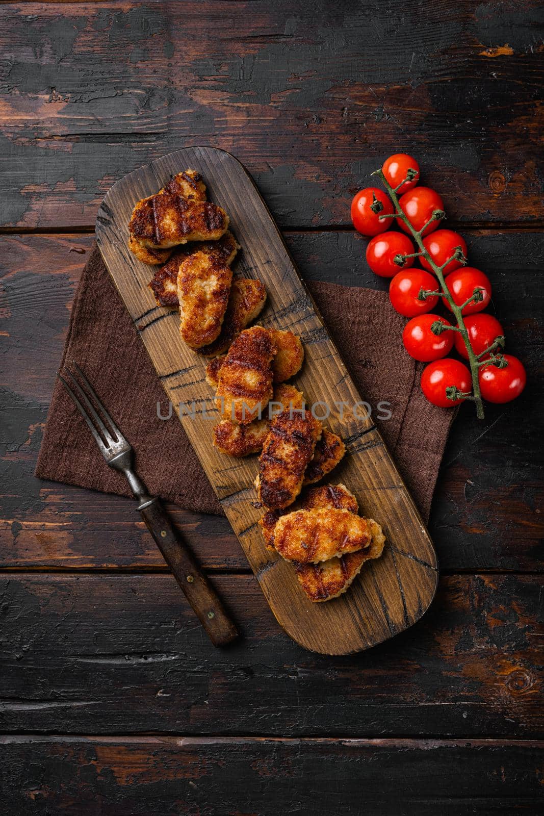 Fried chicken nuggets set, on old dark wooden table background, top view flat lay, with copy space for text by Ilianesolenyi