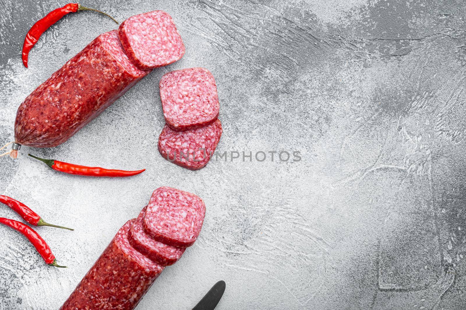 Salami with ingredients, on gray stone table background, top view flat lay, with copy space for text by Ilianesolenyi