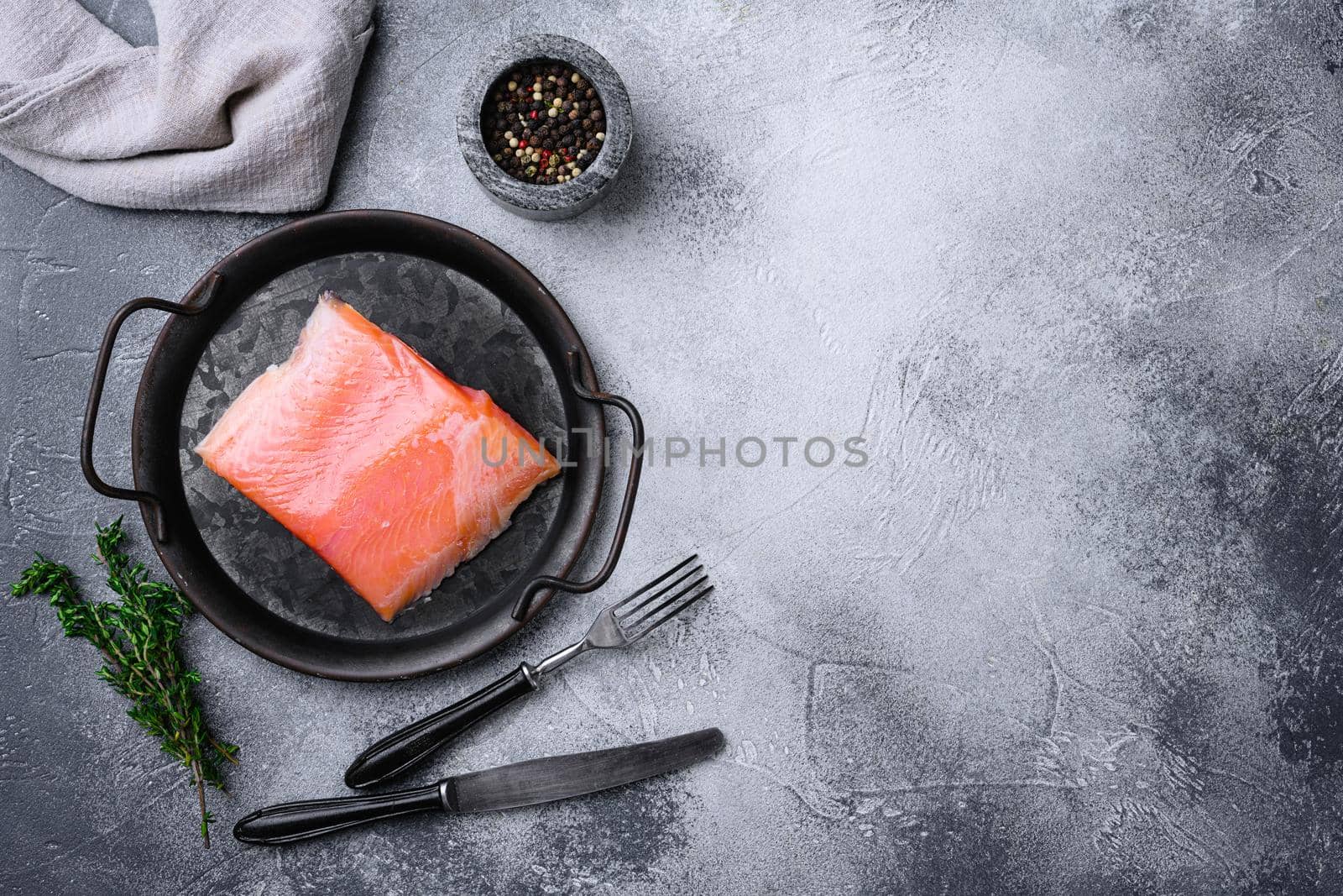Fresh salmon fillet cut set, on gray stone table background, top view flat lay, with copy space for text by Ilianesolenyi
