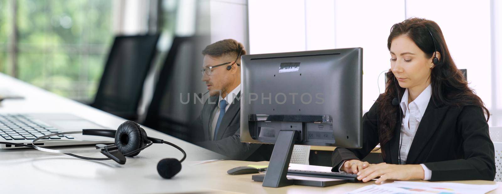 Business people wearing headset working in office to support remote customer or colleague. Call center, telemarketing, customer support agent provide service in broaden view .