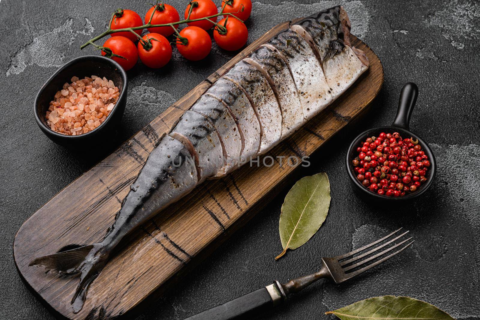 Delicious Braised Mackerel, on black dark stone table background by Ilianesolenyi