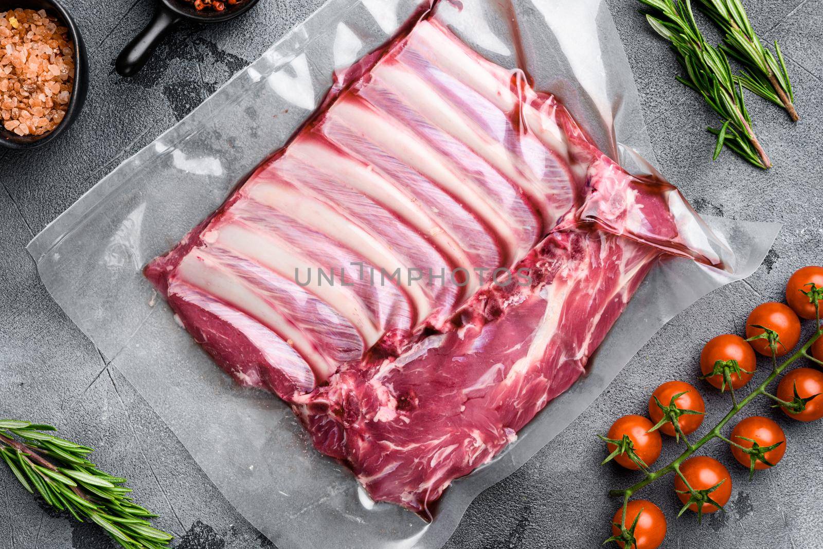 Racks of lamb meat rib fresh pack set, on gray stone table background, top view flat lay