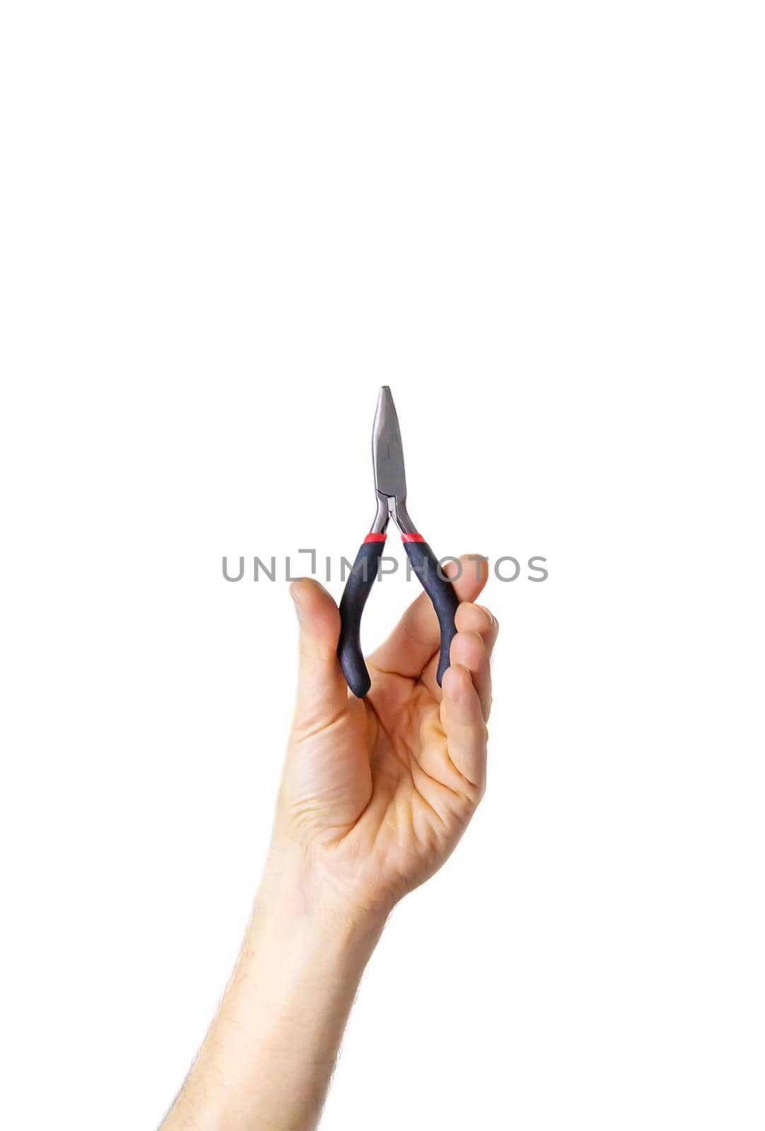 pliers for repair in the hands of a male isolate. Selective focus. by yanadjana