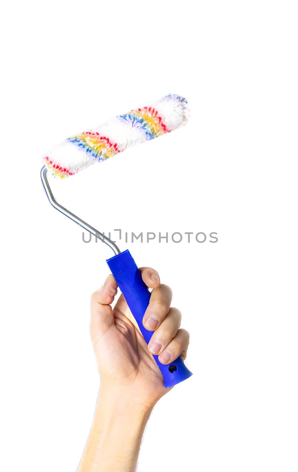 paint roller in the hands of a man isolate. Selective focus. People.